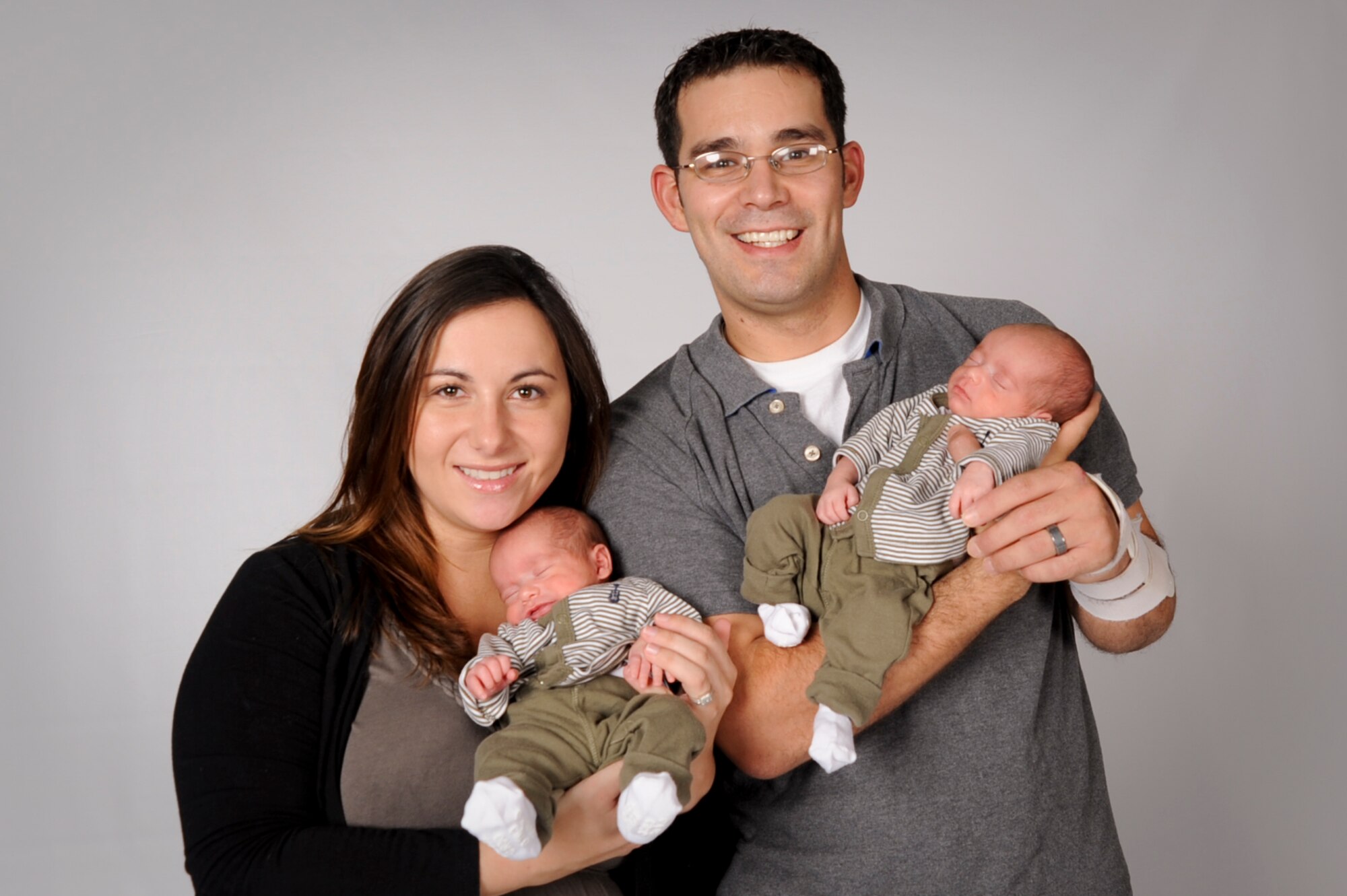 U.S. Air Force Tech. Sgt. John Nandin, 18th Mission Support Group, and his wife Angela, hold their sons Joseph (left) and Daniel (right) at Kadena Air Base, Japan, July 24, 2012. After being born five weeks early, the boys were patients at Camp Lester’s Naval Hospital's neonatal intensive care unit where they received the extra care they needed in order to finally go home with their family. (U.S. Air Force photo/Airman 1st Class Brooke P. Beers)