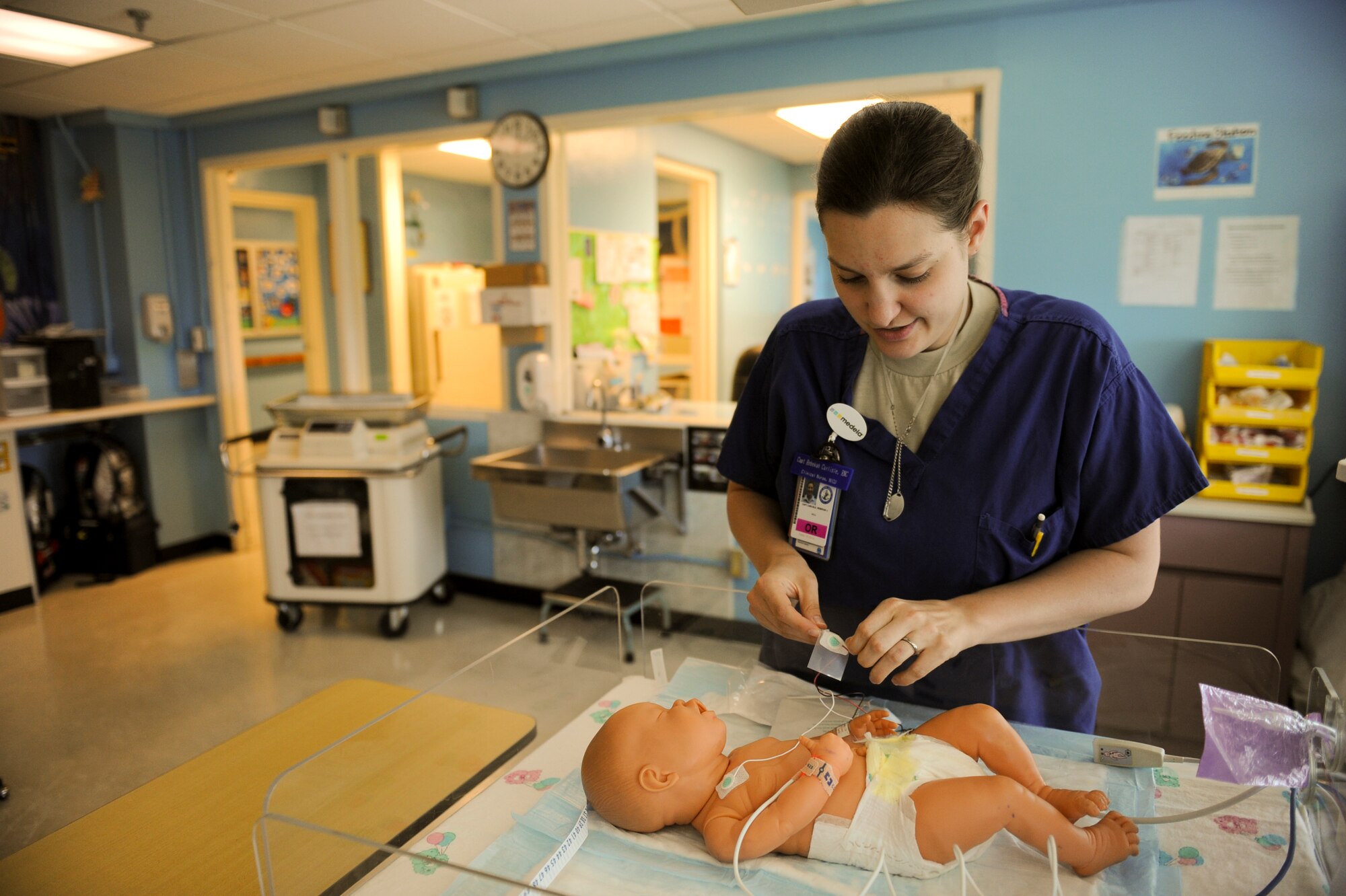 U.S. Air Force Capt. Rabekah Carlisle, 18th Medical Group neonatal intensive care unit nurse, prepares for training on Camp Lester Naval Hospital, Japan, July 20, 2012. Before becoming a NICU nurse, an Air Force member must complete their nursing degree and then attend a 12-week fellowship course at San Antonio, Texas. (U.S. Air Force photo/Airman 1st Class Brooke P. Beers)