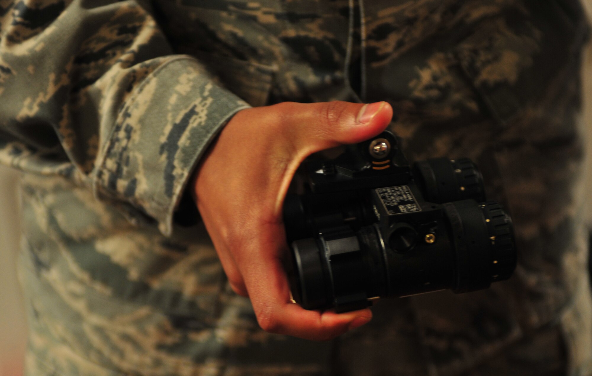 U.S. Airman 1st Class Andrew Mesa, 23d Operations Support Squadron aircrew flight equipment technician, inspects night vision goggles for an A-10C Thunderbolt II pilot from the 74th Fighter Squadron from Moody Air Force Base, Ga., during Red Flag 12-4 at Nellis AFB, Nev., July 23, 2012. After a pilot returns from a mission the AFE technicians perform a post-flight inspection on the pilots equipment. (U.S. Air Force photo by Staff Sgt. Stephanie Mancha/Released)