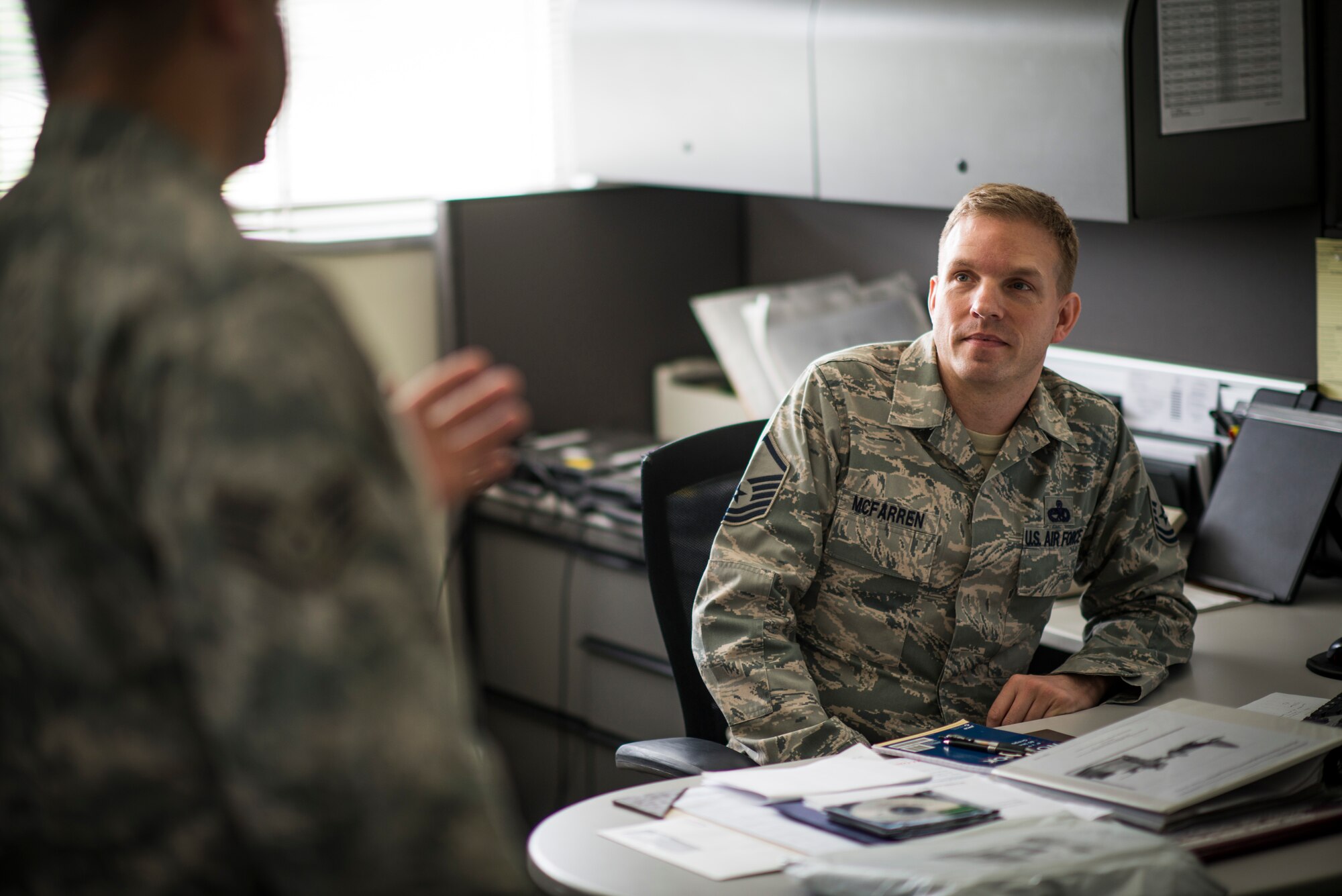 YOKOTA AIR BASE, Japan -- Staff Sgt. Galen Apo, left, 374th Maintenance Group quality assurance inspector, talks about inspection observations with Master Sgt. Gregory McFarren, 374 MXG technical order distribution officer, following an inspection at Yokota Air Base, Japan, July 25, 2012. McFarren is in charge of all the maintenance technical orders for the 374th Airlift Wing, and had no discrepancies during the wing-wide consolidated unit inspection earlier that year. (U.S. Air Force photo/Tech. Sgt. Samuel Morse)