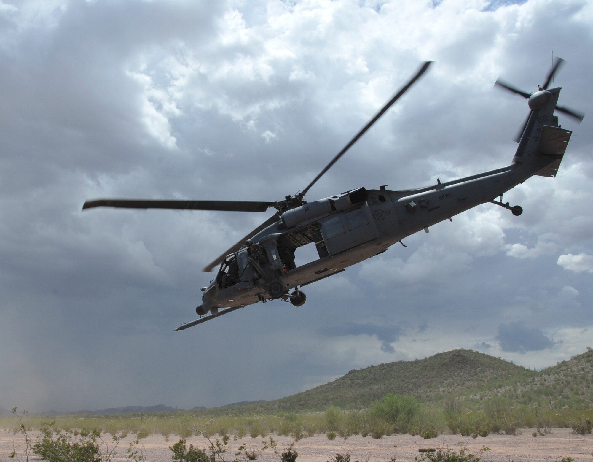 A HH-60 Pave Hawk helicopters from the 305th Rescue Squadron takes off from a training landing zone in the Sonoran Desert outside of Tucson, Ariz. during a training mission. The 305th RQS is an Air Force Reserve unit located at Davis-Monthan Air Force Base Ariz. and is assigned to the 943rd Rescue Group.  The squadron is capable of performing day or night combat rescue mission along with providing humanitarian and disaster relief operation support. (U.S. Air Force photo/ Master Sgt. Luke Johnson) 