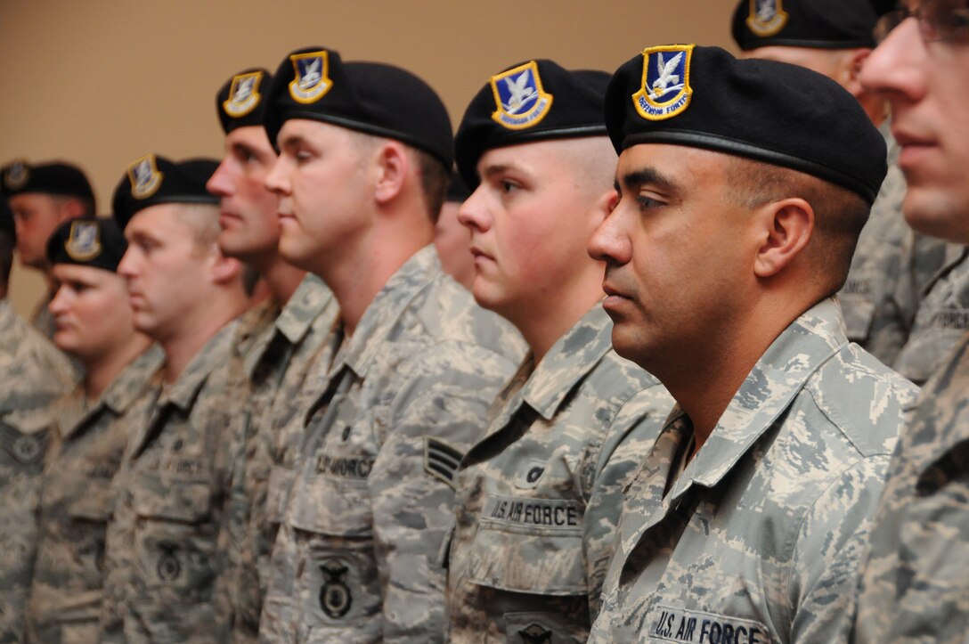 Staff Sgt. William Briones stands at attention with his fellow Airmen of the 173rd Security Forces Squadron during a demobilization ceremony, Saturday, July 21, 2012, recognizing 26 Airmen from the 173 Fighter Wing Security Forces who recently deployed to Afghanistan for six months. (Oregon Air National Guard photo by Tech. Sgt. Jefferson Thompson/released)
