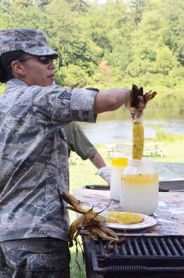 Personnel were treated to lunch of roasted ears of corn and bratwurst at the Dobbins Annual Corn and Sausage Roast held at the base lake July 18. The proceeds are donated to the Dobbins Family Readiness Programs. (U.S. Air Force photo/Don Peek)