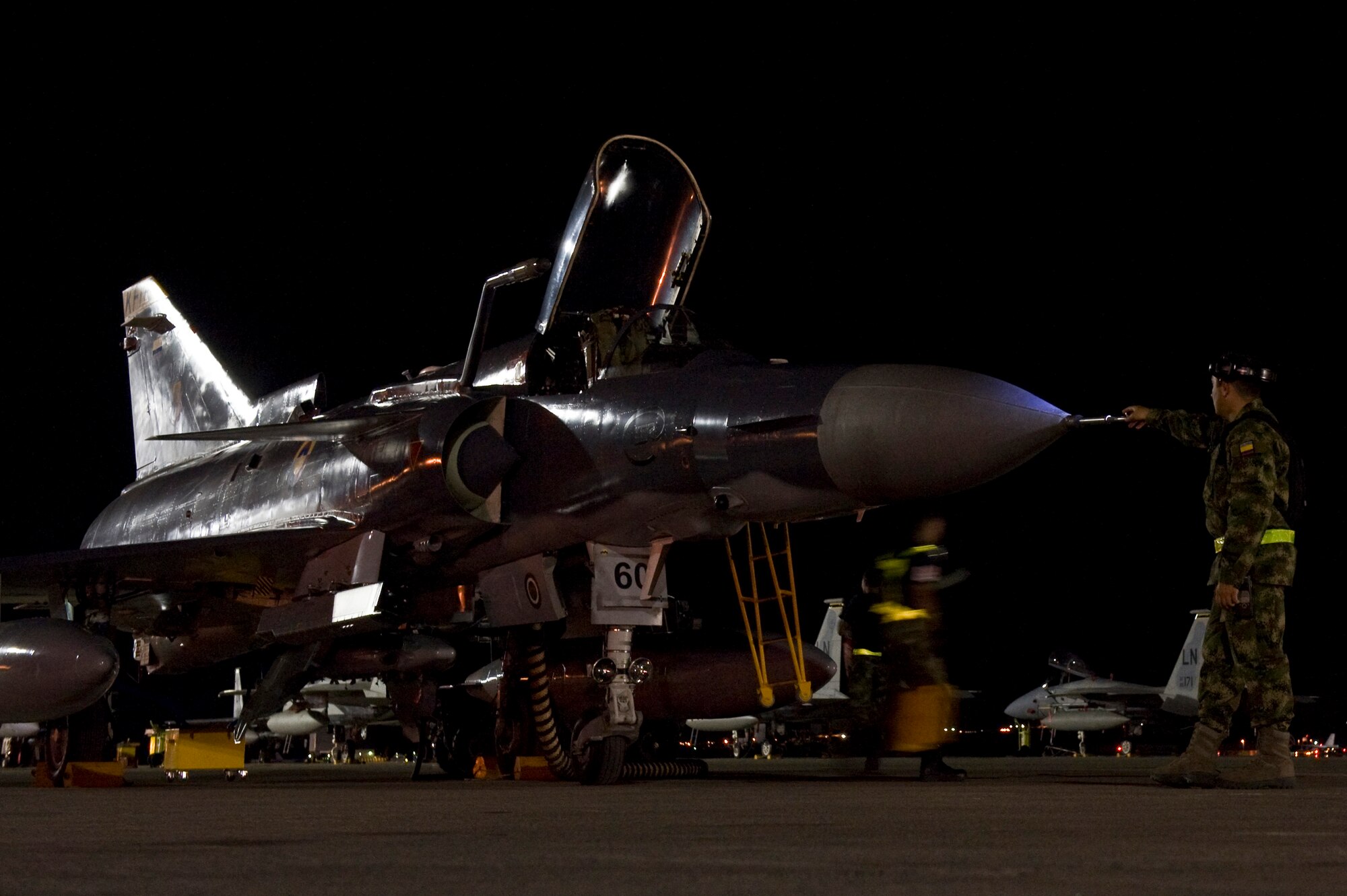 Colombia air force air crew members prepare the Kfir for a night exercise during Red Flag 12-4 July 24, 2012, at Nellis Air Force Base, Nev. The journey Colombia made to participate in Red Flag started more than three years ago when its air force was recognized for its ability to perform air operations in complex environments. (U.S. Air Force photo by Airman 1st Class Daniel Hughes)

