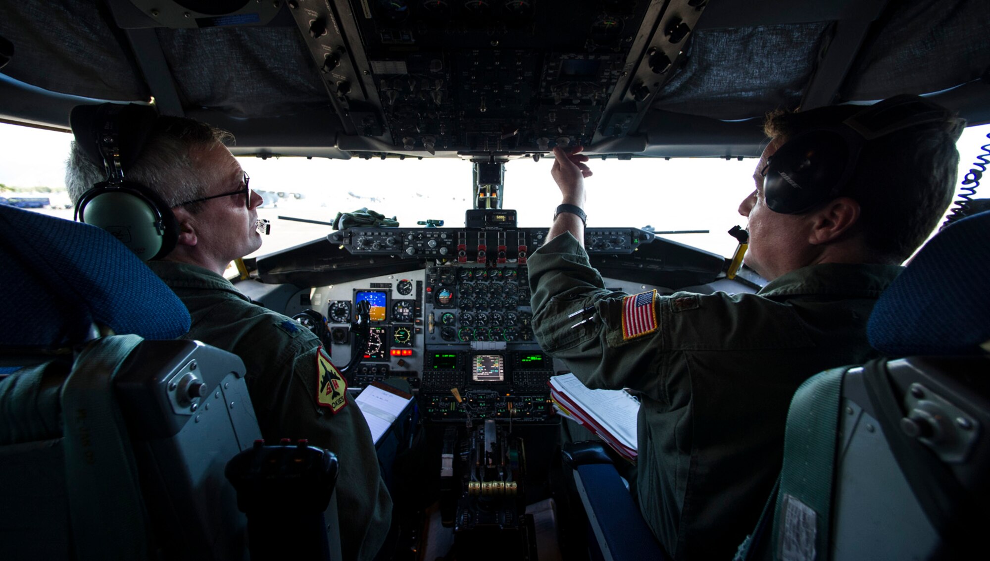 JOINT BASE PEARL HARBOR-HICKAM (July 23, 2012) -  Lieutenant Colonel Randy Sauer and Major Jeff Milburn, both KC-135 Stratotanker pilots with the 465 Air Refueling Squadron, Tinker Air Force Base, Oklahoma, perform pre-flight checklists during Rim of the Pacific exercise, July 23, 2012. Twenty-two nations, more than 40 ships and submarines, more than 200 aircraft and 25,000 personnel are participating are participating in the biennial RIMPAC exercise from June 29 to Aug. 3, in and around the Hawaiian Islands. The world's largest international maritime exercise, RIMPAC provides a unique training opportunity that helps participants foster and sustain the cooperative relationships that are critical to ensuring the safety of sea lanes and security on the world's oceans. RIMPAC 2012 is the 23rd exercise in the series that began in 1971. (U.S. Air Force photo by Tech. Sgt. Bradley C. Church)