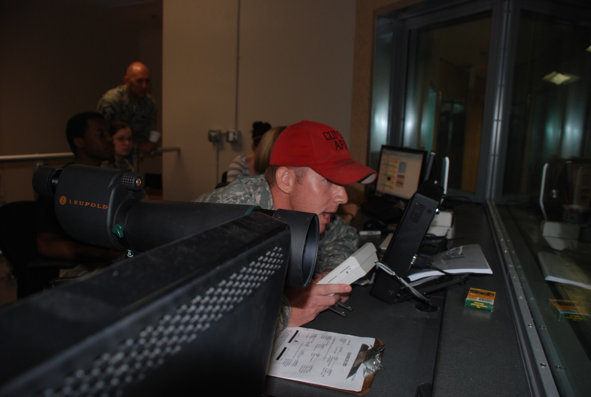 Staff Sgt. Michael O’Neil, 81 Security Forces Squadron Combat Arms, announces course of fire instructions during the inaugural Pistol Competition at Keesler's
indoor firing range July 20, 2012. Representatives from Air Force Office of Special Investigations, 81st Security Forces Squadron, Biloxi, Ocean Springs, Gulfport and D'Iberville Police Departments, the Drug Enforcement Administration and Customs and Border Protection competed in two rounds of various pistol shootings. Gulfport Police Department won the over-all team award but SFS’s Tech Sgt. Nicholas Tessmer won “Top Shot.” (U.S. Air Force photo/Staff Sgt. Kimberly Rae Moore)
