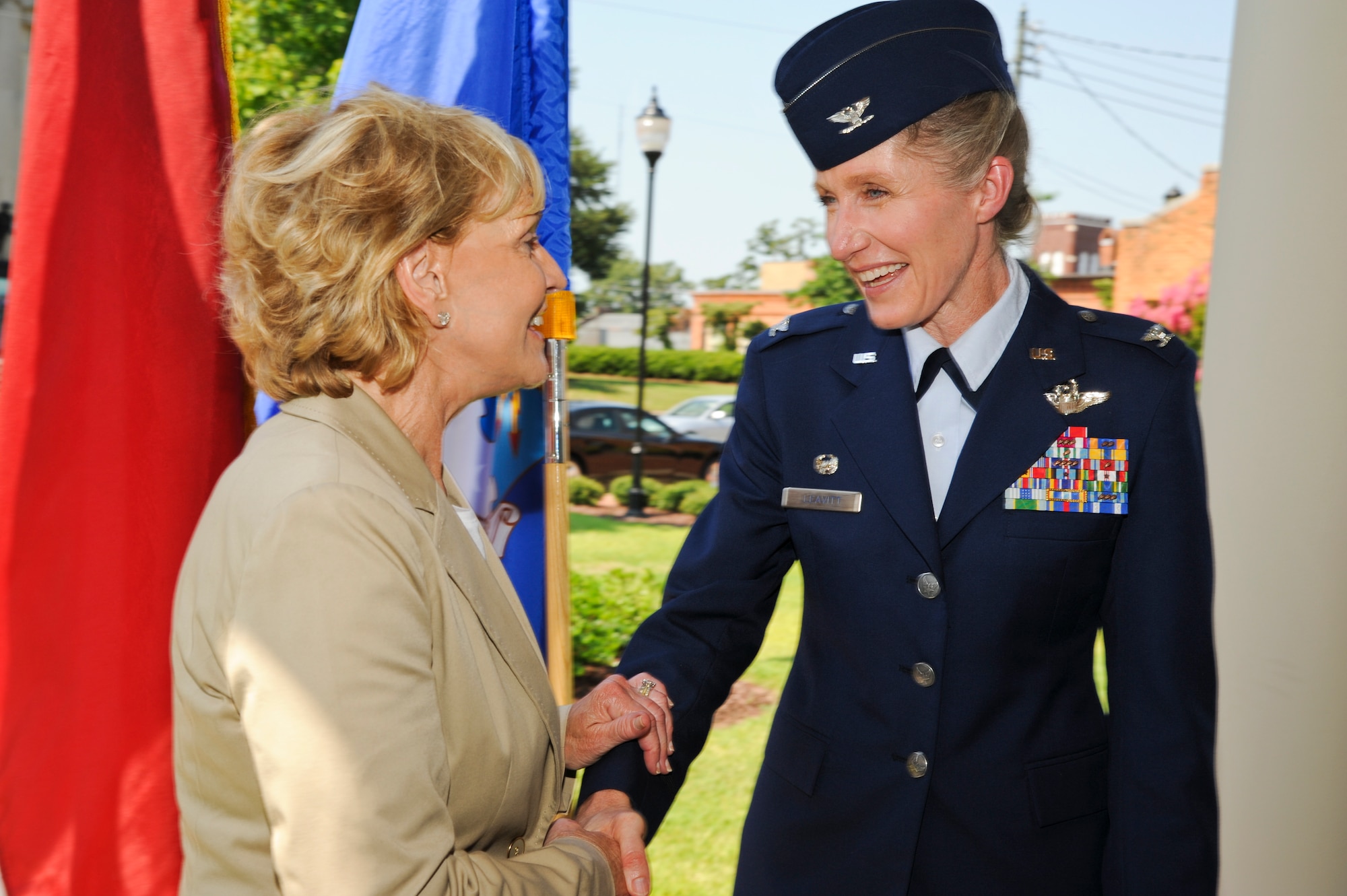 North Carolina Governor Bev Perdue shakes hands with U.S. Air Force Col. Jeannie Leavitt, 4th Fighter Wing commander, after signing House Bill 799 at the Wayne County Veterans Memorial in downtown Goldsboro, N.C. July 24, 2012. The bill is designed to help military spouses and veterans to obtain N.C. occupational licensing to more quickly enter the state’s workforce. (U.S. Air Force photo/Tech. Sgt. Colette Graham/Released)