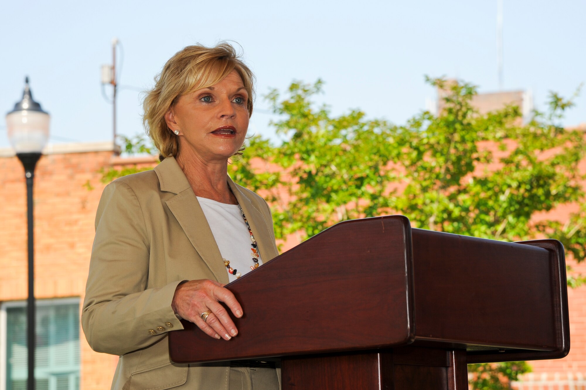 North Carolina Governor Bev Perdue speaks about House Bill 799 during a bill signing ceremony at the Wayne County Veterans Memorial in downtown Goldsboro, N.C. July 24, 2012. The bill will help simplify job certification procedures for military spouses and veterans entering the N.C. workforce. Perdue signed the bill at the end of the ceremony. (U.S. Air Force photo/Tech. Sgt. Colette Graham/Released)
