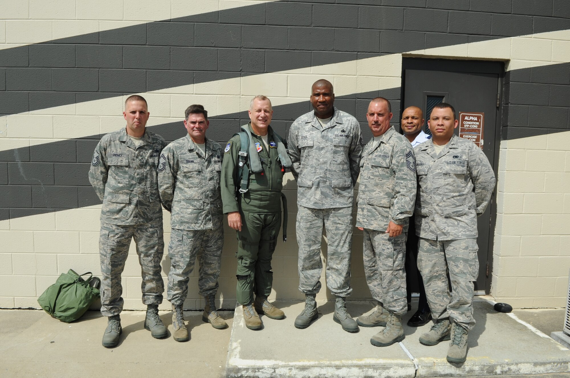 U.S. Air Force Maj. Gen. Lawrence Wells, 9th Air Force commander, poses with Airmen from the 4th Logistics Readiness Squadron petroleum, oil, and lubricants flight during a tour on Seymour Johnson Air Force Base, N.C., July 16, 2012. The general toured various work centers around the base for a first-hand view of how Airmen at the 4th Fighter Wing carry out the Air Combat Command mission. (U.S. Air Force photo/Senior Airman Gino Reyes/Released)