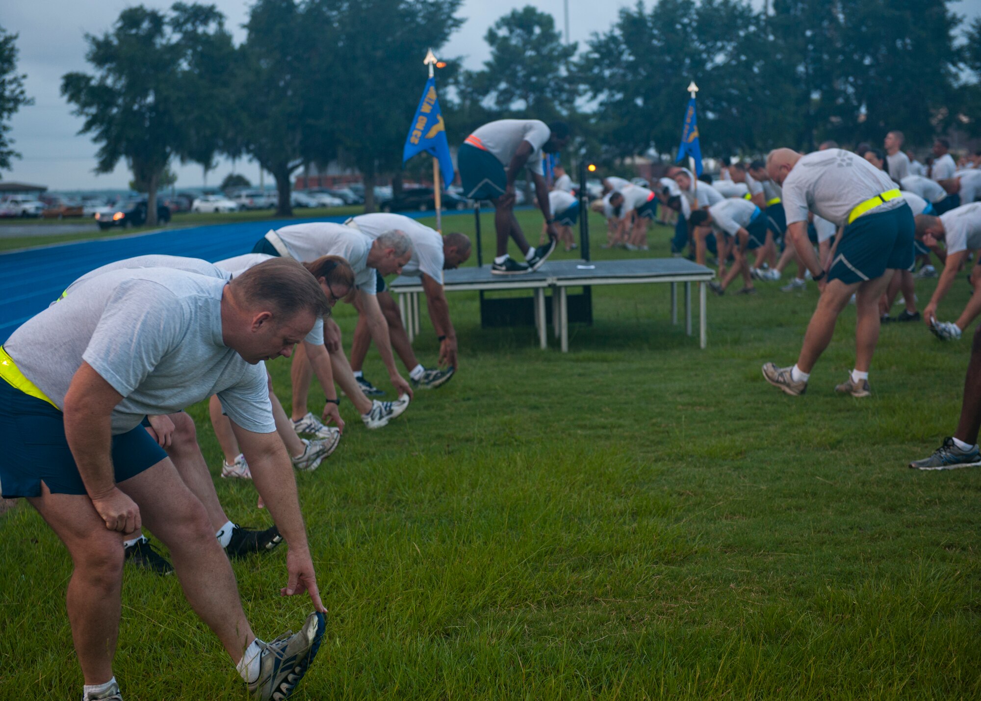 Airmen with the 23d Mission Support Group stretch prior to their first unit fun run July 20, 2012, at Moody Air Force Base, Ga. The 23d MSG will hold a fun run every quarter. (U.S. Air Force photo by Senior Airman Eileen Meier/Released)