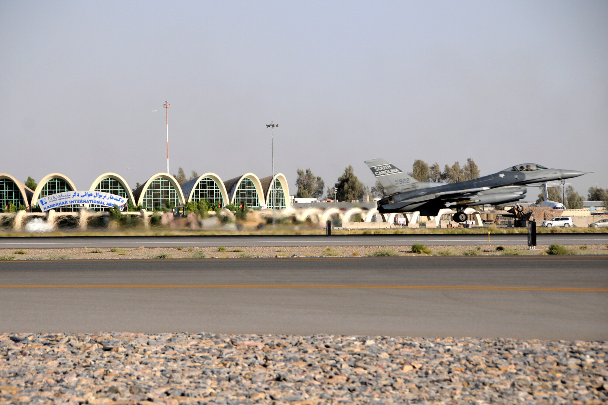 An F-16 with the 157th Expeditionary Fighter Squadron, flown by Major Stephen "Boards" Kaminski, takes off at Kandahar Airfield for a day-time mission over Afghanistan on July 1, 2012.  Personnel are deployed from McEntire Joint National Guard Base, S.C., in support of Operation Enduring Freedom. Swamp Fox F-16's, pilots, and support personnel began their Air Expeditionary Force deployment in early April to take over flying missions for the air tasking order and provide close air support for troops on the ground in Afghanistan. (U.S. Air Force photo/Tech. Sgt. Stephen Hudson)