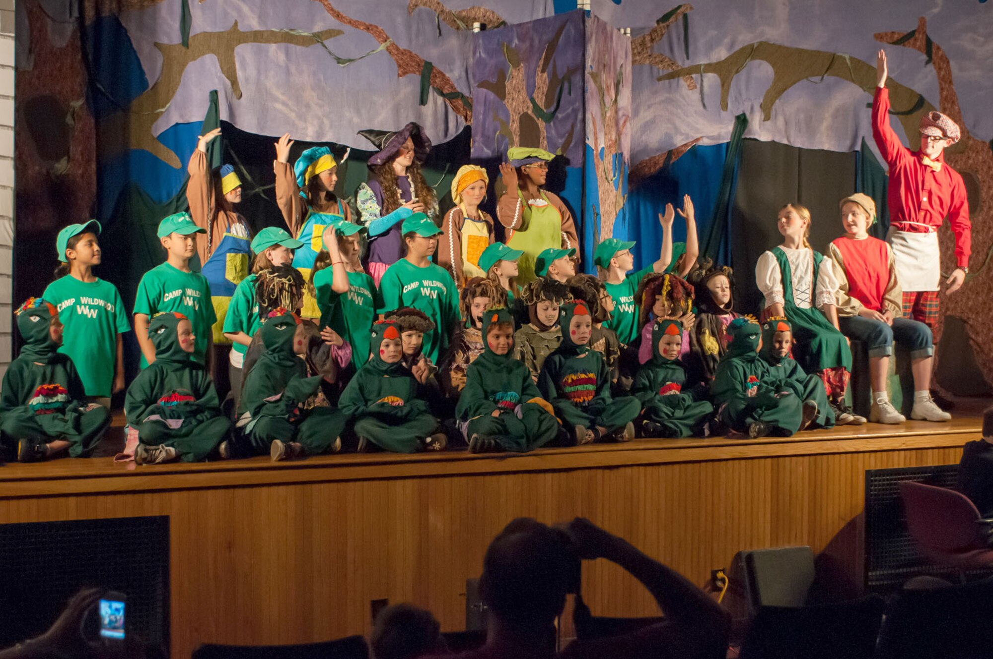 HANSCOM AIR FORCE BASE, Mass. – Cast members of the Missoula Children’s Theatre take turns bowing after performing in the show, Hansel and Gretel, July 21. The Missoula Children’s Theatre has been touring for 37 years and provides a week-long residency with two professional actors and allows 50 to 60 local students to participate in a full-scale musical. The intense week starts with auditions on Monday and ends with two performances on Saturday. (U.S. Air Force photo by Rick Berry)