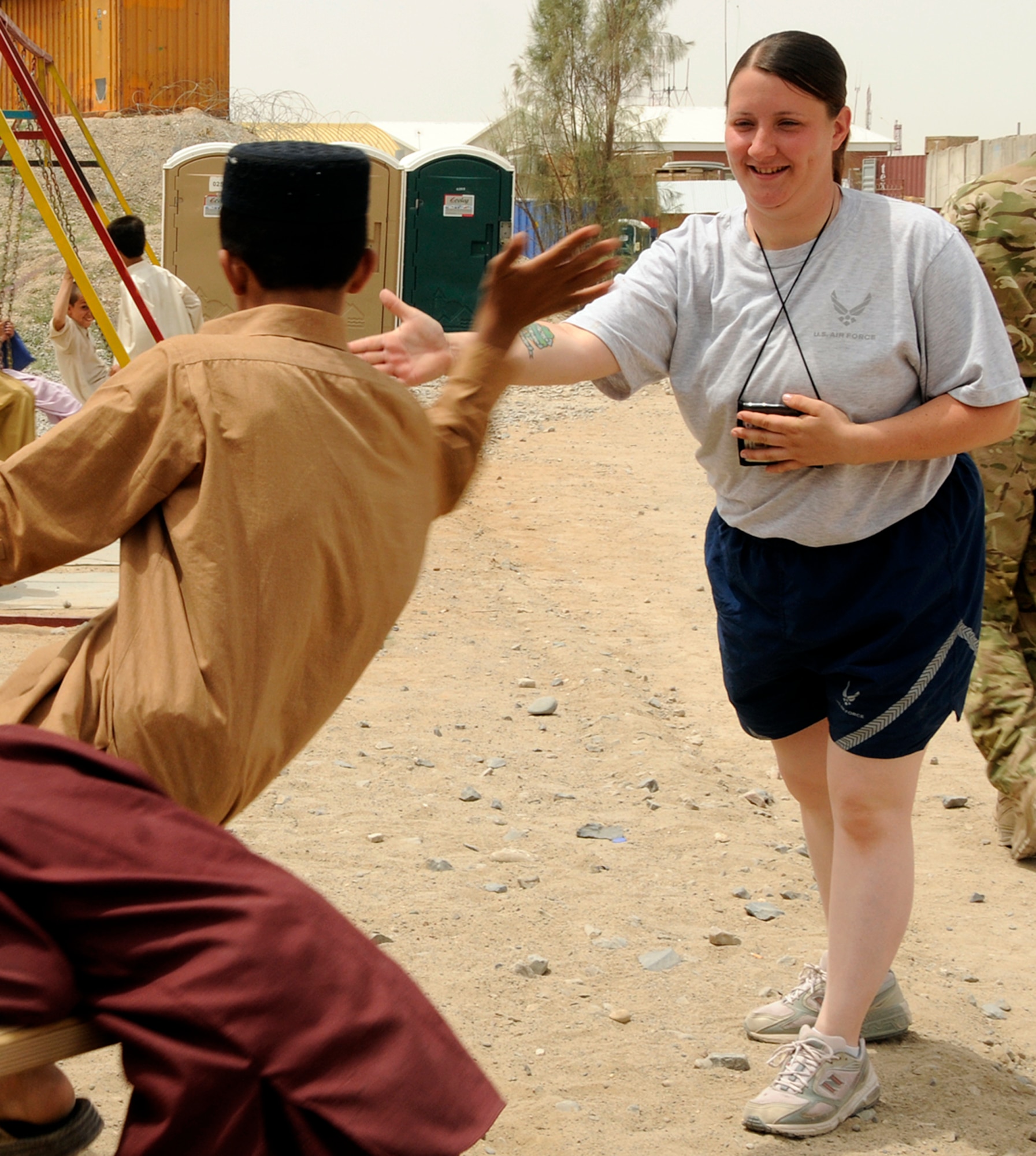Airman 1st Class Rhiannon O'Leary, an ammo troop assigned to the 451st Expeditionary Maintenance Squadron at Kandahar Airfield, Afghanistan, interacts with the local children attending the bazaar school May 5, 2012. Personnel are deployed from McEntire Joint National Guard Base, S.C., in support of Operation Enduring Freedom. Swamp Fox F-16's, pilots, and support personnel began their Air Expeditionary Force deployment early April to take over flying missions for the air tasking order and provide close air support for troops on the ground in Afghanistan.
(U.S. Air Force photo/Tech. Sgt. Caycee Cook)
