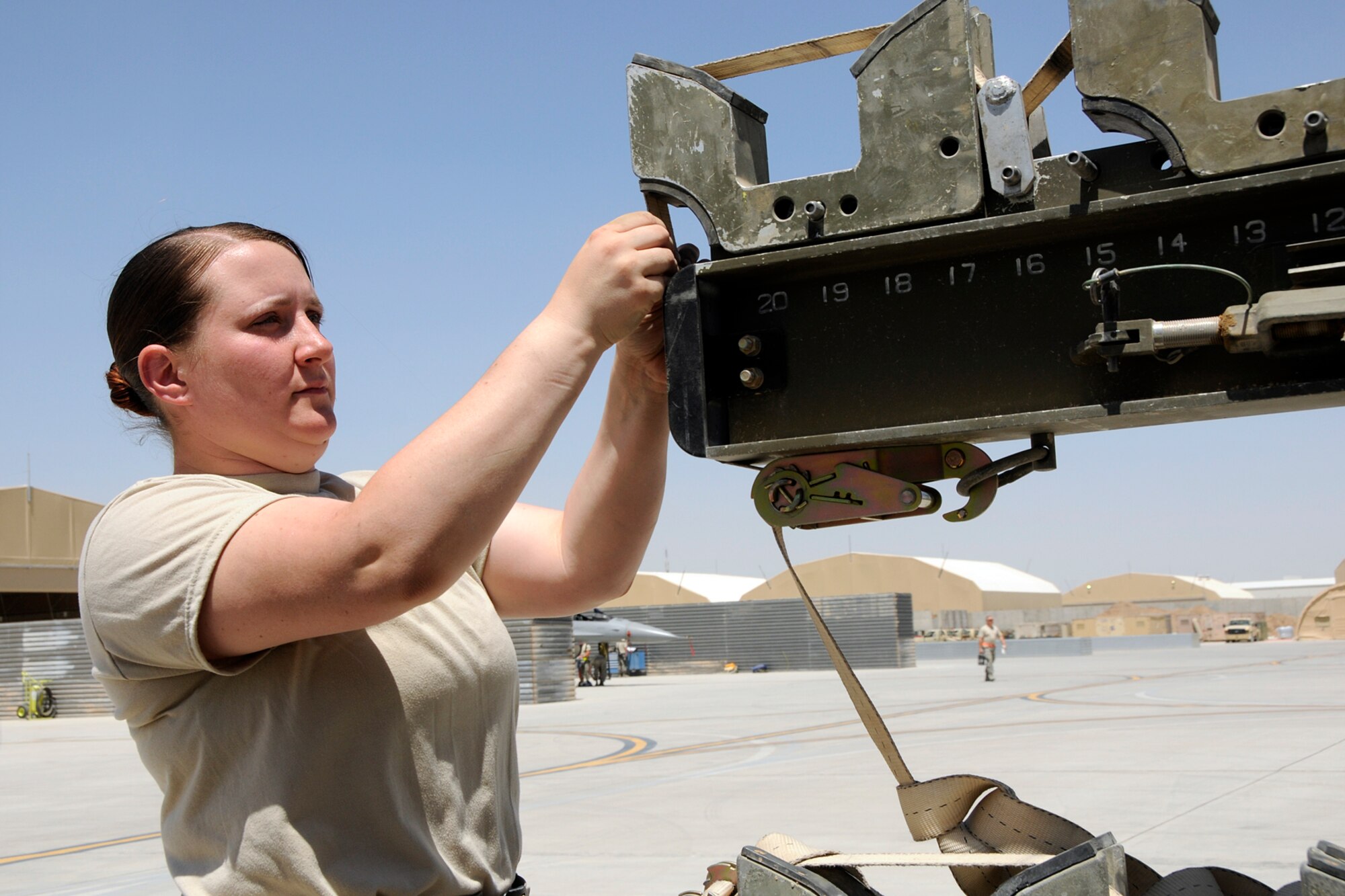 Airman 1st Class Rhiannon O'Leary, an ammo technician assigned to the 451st Expeditionary Maintenance Squadron at Kandahar Airfield, Afghanistan, secures missiles downloaded from an F-16 Fighting Falcon to the ammo rack May 3, 2012. A1C O'Leary is deployed from McEntire Joint National Guard Base, S.C., in support of Operation Enduring Freedom. Swamp Fox F-16's, pilots, and support personnel began their Air Expeditionary Force deployment early April to take over flying missions for the air tasking order and provide close air support for troops on the ground in Afghanistan.
(U.S. Air Force photo/Tech. Sgt. Caycee Cook)
