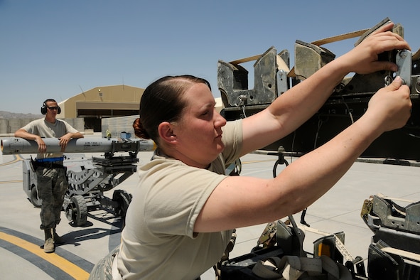 Airman 1st Class Rhiannon O'Leary, an ammo technician assigned to the 451st Expeditionary Maintenance Squadron at Kandahar Airfield, Afghanistan, prepares the ammunition rack for missiles that were downloaded from an F-16 Fighting Falcon May 3, 2012. A1C O'Leary is deployed from McEntire Joint National Guard Base, S.C., in support of Operation Enduring Freedom. Swamp Fox F-16's, pilots, and support personnel began their Air Expeditionary Force deployment early April to take over flying missions for the air tasking order and provide close air support for troops on the ground in Afghanistan.
(U.S. Air Force photo/Tech. Sgt. Caycee Cook)
