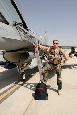Colonel David Meyer, vice commander and fighter pilot assigned to the 451st Expeditionary Operations Group at Kandahar Airfield, Afghanistan, poses for a photo with an F-16 Fighting Falcon before launching for a mission May 28, 2012. Personnel are deployed from McEntire Joint National Guard Base, S.C., in support of Operation Enduring Freedom. Swamp Fox F-16's, pilots, and support personnel began their Air Expeditionary Force deployment early April to take over flying missions for the air tasking order and provide close air support for troops on the ground in Afghanistan.
(U.S. Air Force photo/Tech. Sgt. Caycee Cook)
