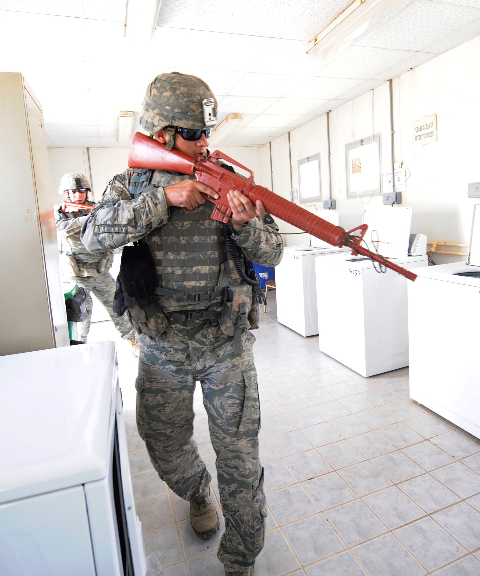 SOUTHWEST ASIA – Tech. Sgt. Stephen Cotta, 386th Expeditionary Security Forces Squadron assistant flight chief and first responder, enters the laundry facility during an active-shooter exercise here July 23. The exercise tested the base’s ability to respond to a crisis situation in the event that a real-world threat occurs. (U.S. Air Force photo/Staff Sgt. Alexandra M. Boutte)
