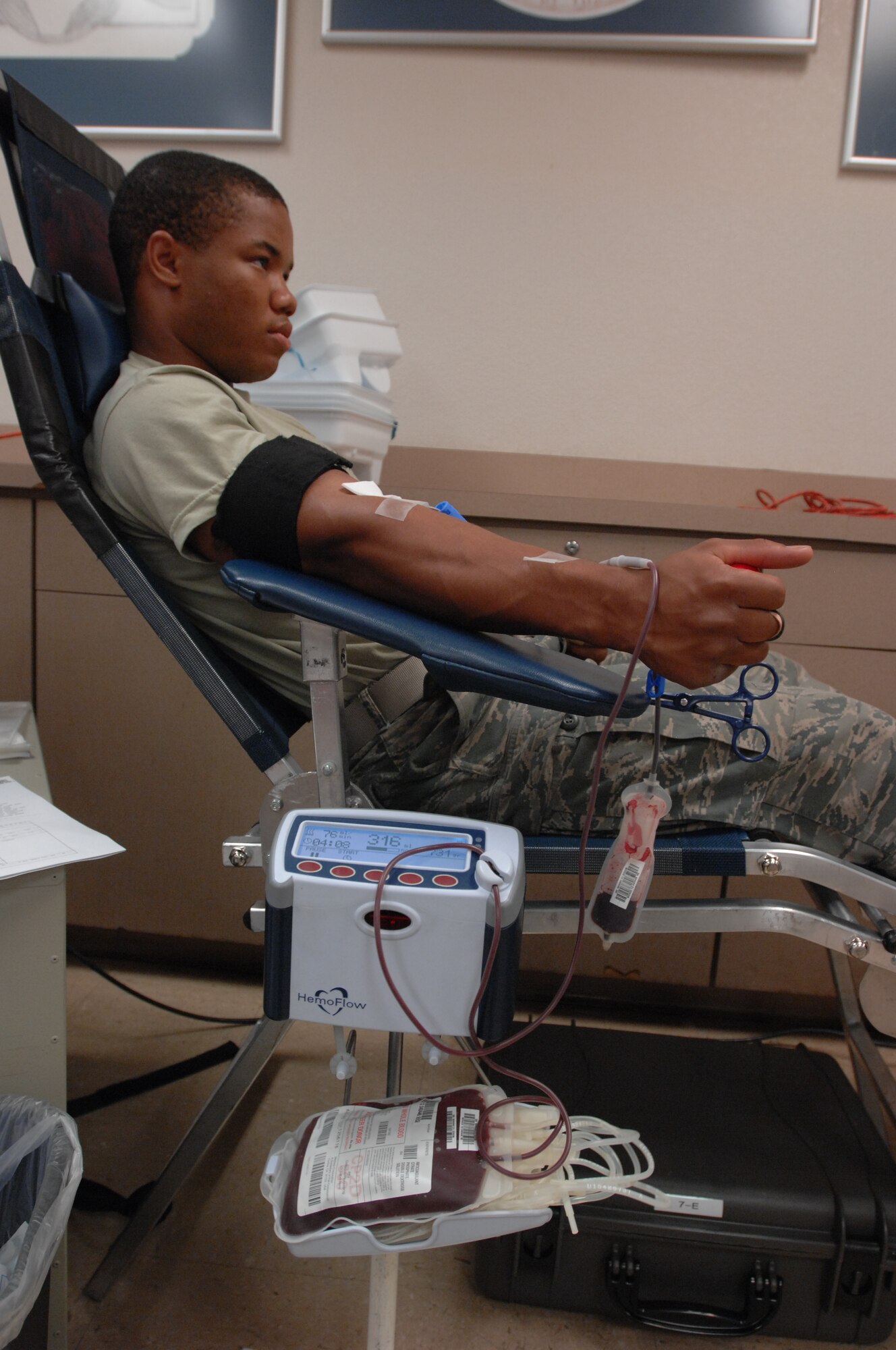 U.S. Air Force Airman 1st Class Keeshond White, 99th Logistic Readiness Squadron vehicle maintenance apprentice, donates blood July 20, 2012 at the Outdoor Recreation Center, Nellis Air Force Base. Nev. White was one of 94 donors to donate 132 units over a two day period. (U.S. Air Force photo by Master Sgt. David Miller)