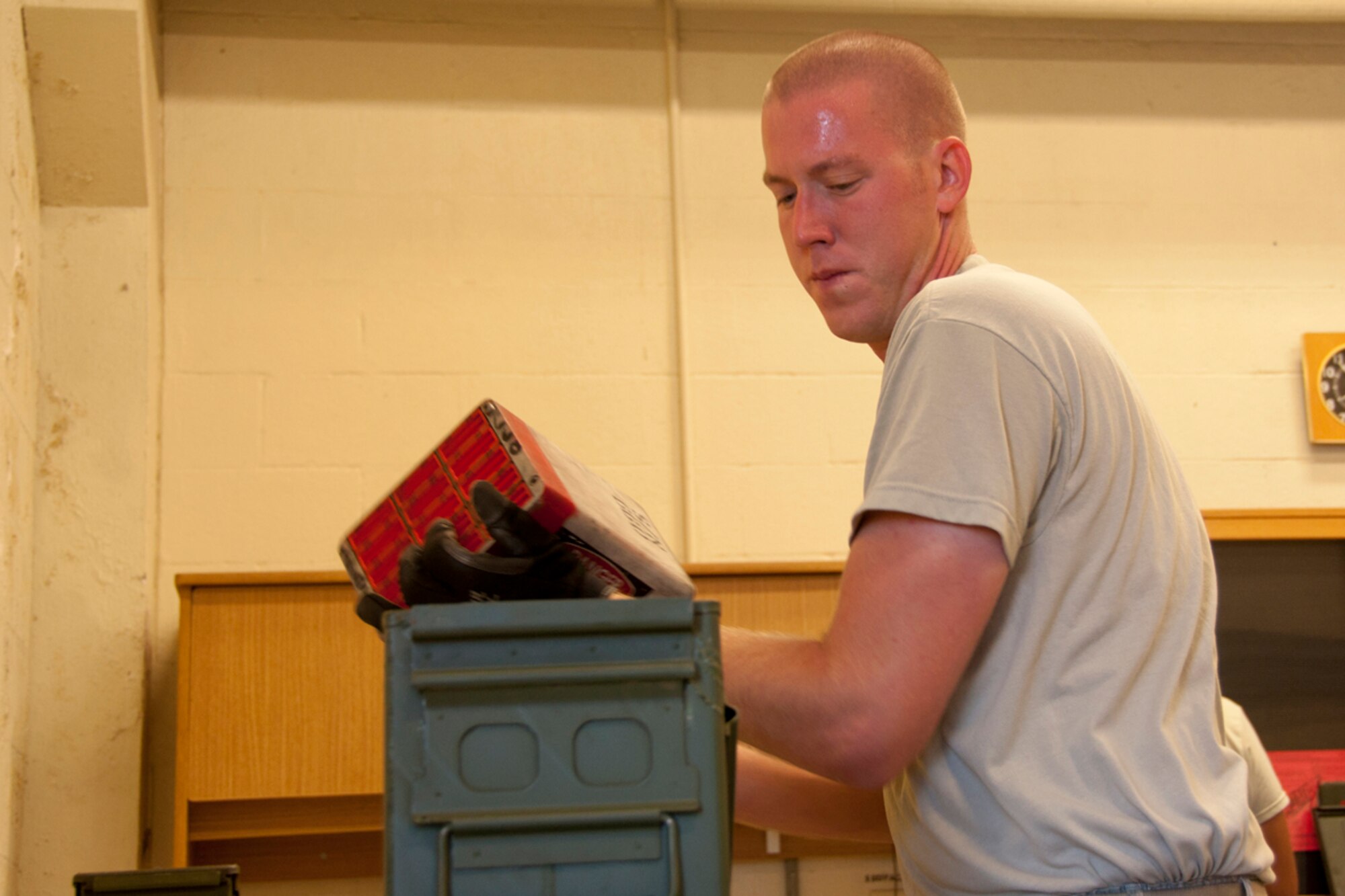 JOINT BASE PEARL HARBOR-HICKAM, Hawaii - U.S. Air Force Staff Sgt. Jae Simmons, 917th Maintenance Squadron munitions systems technician from Barksdale Air Force Base, La., loads a flare module into an ammunition box during the Rim of the Pacific military exercise July 20, 2012, at Joint Base Pearl Harbor-Hickam, Hawaii. Twenty-two nations, more than 40 ships and submarines, more than 200 aircraft and 25,000 personnel are participating in RIMPAC exercise from June 29 to Aug. 3, in and around the Hawaiian Islands. The world's largest international maritime exercise, RIMPAC provides a unique training opportunity that helps participants foster and sustain the cooperative relationships that are critical to ensuring the safety of sea lanes and security on the world's oceans. RIMPAC 2012 is the 23rd exercise in the series that began in 1971. (U.S. Air Force photo by Staff Sgt. Ted Daigle)