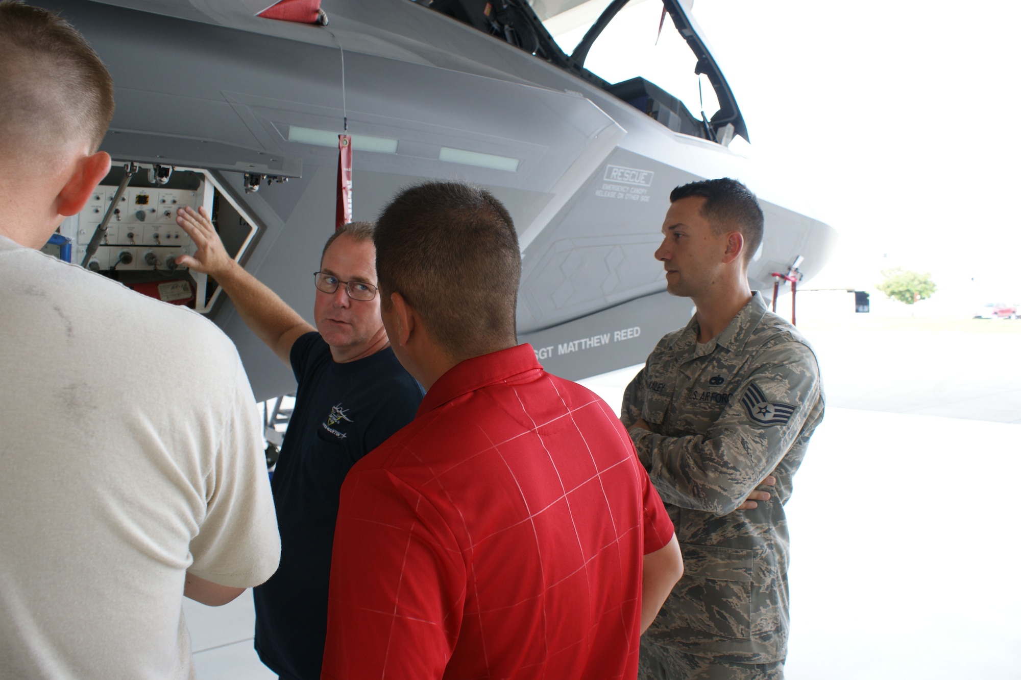 Students discuss a training problem during F-35 Lightning II joint strike fighter training as Staff Sgt. Jeff Kakaley (right), F-35 crew chief instructor, observes during training at Eglin Air Force Base, Fla., Jul. 19, 2012.  The 372nd Training Squadron Detachment 19 at Eglin, part of the 982nd Training Group at Sheppard Air Force Base, trains both Air Force and Marines on F-35 maintenance. (U.S. Air Force photo/Dan Hawkins)