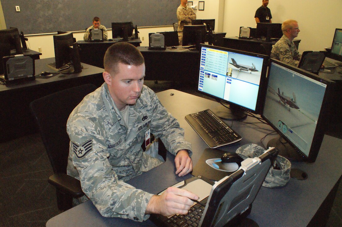Staff Sgt. David Martindale, 31st Test and Evaluations Squadron at Edwards Air Force Base, Calif. and an F-35 maintenance student, gets ready to work on a training problem Jul. 19, 2012 at Eglin Air Force Base, Fla.  F-35 maintenance training is conducted by the 372nd Training Squadron Detachment 19, part of the 982nd Training Group at Sheppard Air Force Base.  (U.S. Air Force photo/Dan Hawkins)