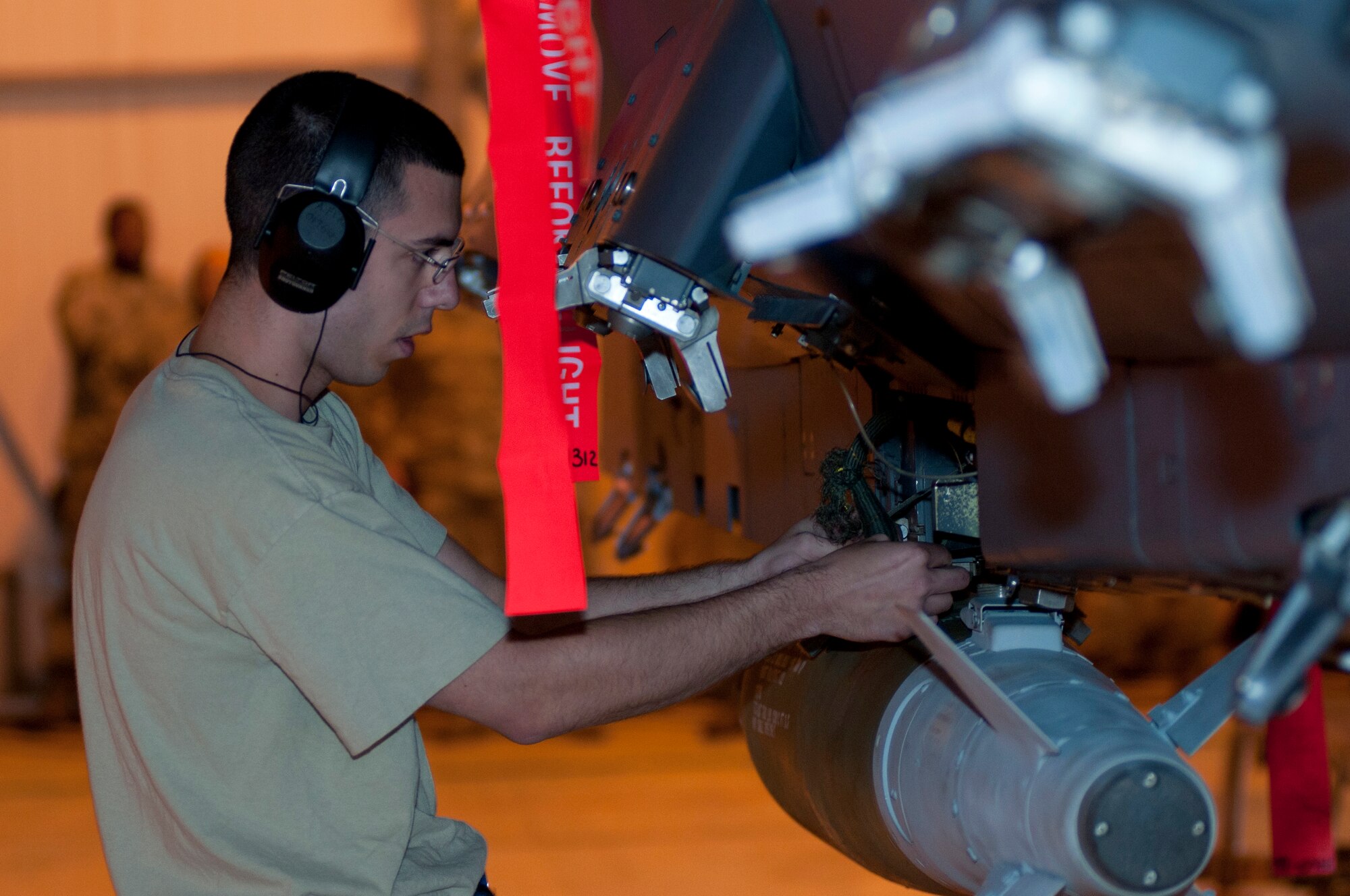 ROYAL AIR FORCE LAKENHEATH, England – Senior Airman Anthony Feret, 492nd Air Craft Maintenance Unit weapons load crew member, checks a Guided Bomb Unit-38 munition during the Load Crew of the Quarter Competition July 20, 2012. The quarterly competition features the best load crew teams from the 492nd, 493rd and 494th Aircraft Maintenance Units. The winner is determined by the fastest time loading munitions with the least amount of errors. (U.S. Air Force photo by Airman 1st Class Cory D. Payne)