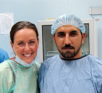 Major Courtney Schapira, 628th Medical Group dentist, poses for a photograph with Janat Khan Hamdard post-surgery at the Paktia Regional Military Hospital in Gardez, Afghanistan sometime during her deployment from November 2011 until May 2012. Schapira was the first, and only, Air Force dental advisor in Afghanistan. (Courtesy photo)