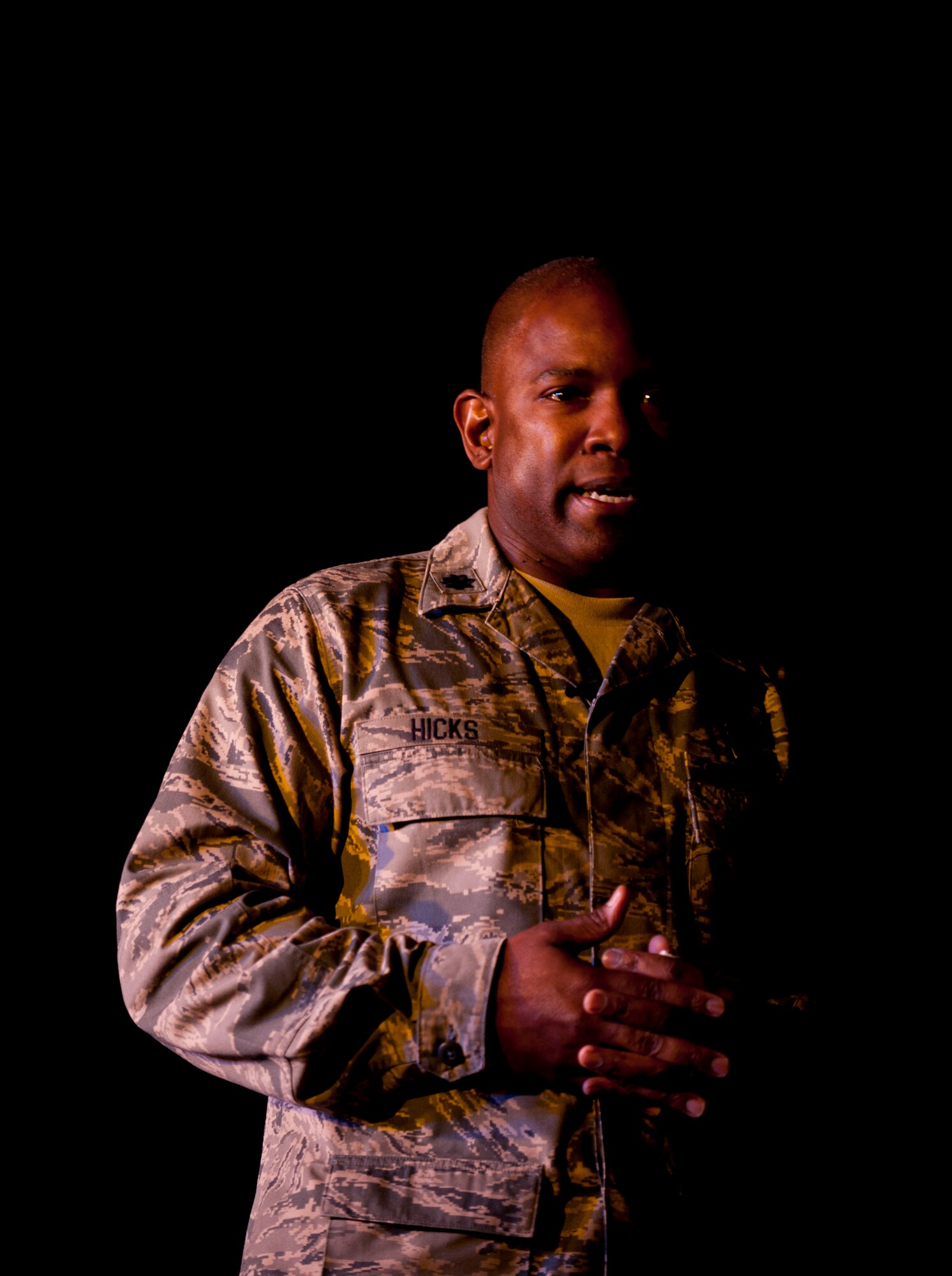 Lt. Col. Lawrence Hicks, 39th Mission Support Group deputy commander, speaks about being in South Korea unaccompanied when his wife miscarried their child and how he coped with it during the Storytellers event July 19, 2012, at Incirlik Air Base, Turkey. Storytellers offers Incirlik residents a chance to hear other Airmen's life defining stories and learn from their experiences. The event was created by members of the Incirlik Toastmasters Club in response to an open question from Chief Master Sgt. of the Air Force James Roy on how to create community connections and open dialogue among Airmen. (U.S. Air Force photo by Senior Airman Clayton Lenhardt/Released)