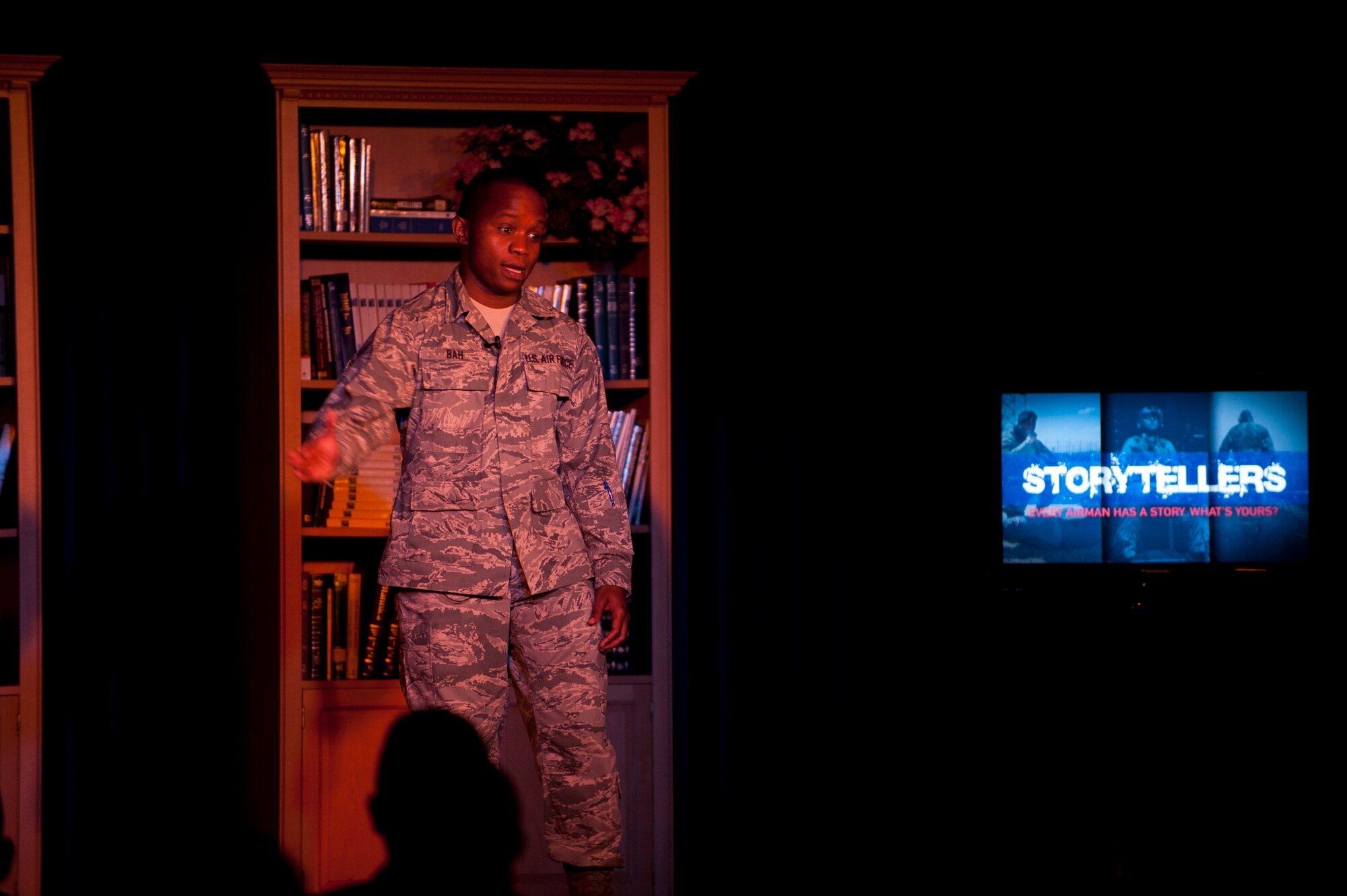 Senior Airman Mohamed Bah, 39th Logistics Readiness Squadron, gives his account of growing up in Sierra Leone during a civil war and the death of his family during the Storytellers event July 19, 2012, at Incirlik Air Base, Turkey. Storytellers offers Incirlik residents a chance to hear other Airmen's life defining stories and learn from their experiences. The event was created by members of the Incirlik Toastmasters Club in response to an open question from Chief Master Sgt. of the Air Force James Roy on how to create community connections and open dialogue among Airmen. (U.S. Air Force photo by Senior Airman Clayton Lenhardt/Released)
