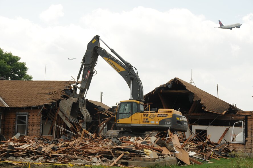 Building 865 is demolished after being a presence on base since the 1940s.  The building was previously used as a Navy cafeteria, and to house the Civil Engineer Squadron and Security Forces Squadron.  Future plans for the site are currently being studied. (Air Force Photo/Paul Zadach) 