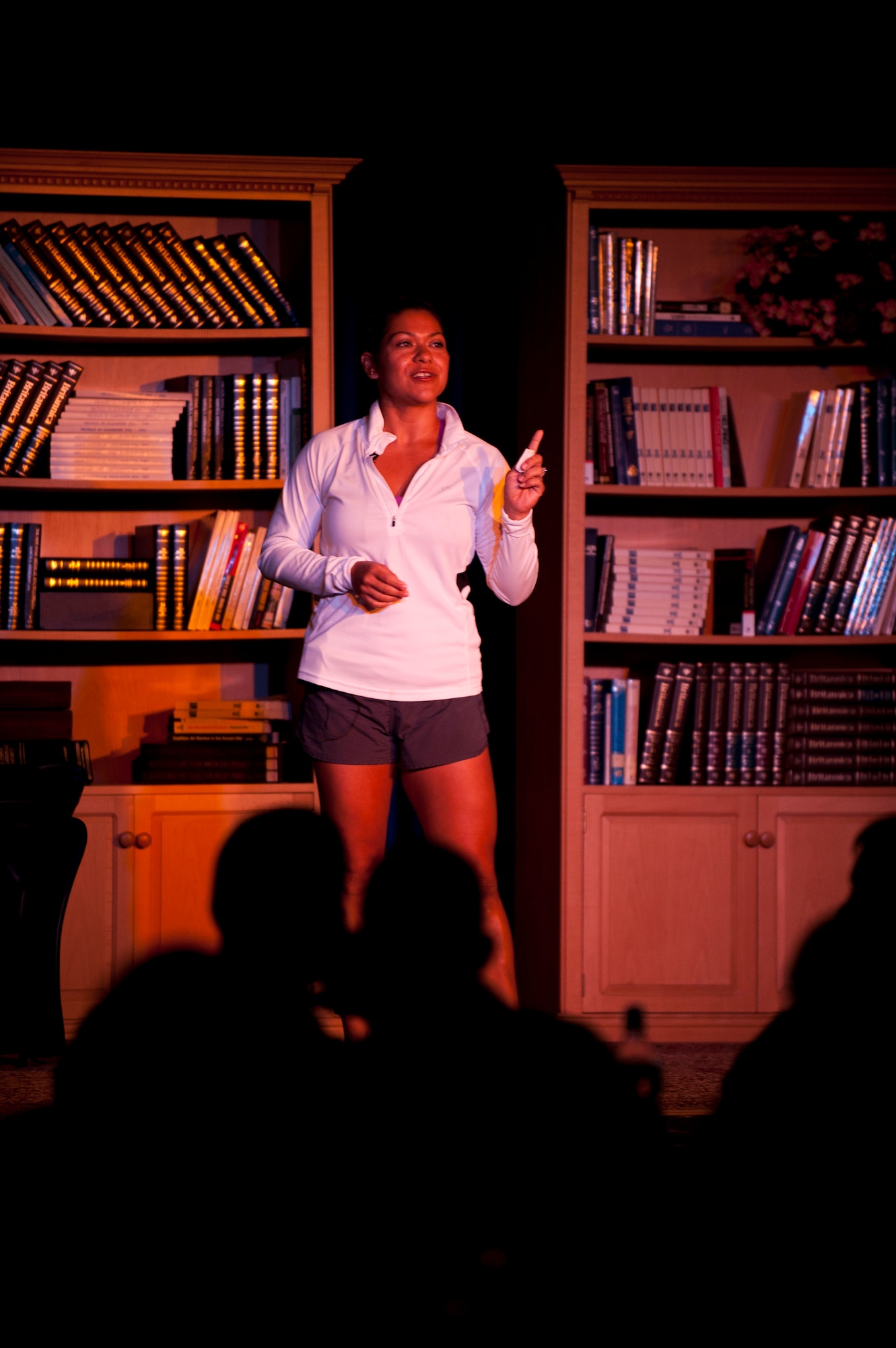 Karla Alexander tells how she gained and eventually lost weight after the birth of her children during the Storytellers event July 19, 2012, at Incirlik Air Base, Turkey. Storytellers offers Incirlik residents a chance to hear other Airmen's life defining stories and learn from their experiences. The event was created by members of the Incirlik Toastmasters Club in response to an open question from Chief Master Sgt. of the Air Force James Roy on how to create community connections and open dialogue among Airmen. (U.S. Air Force photo by Senior Airman Clayton Lenhardt/Released)