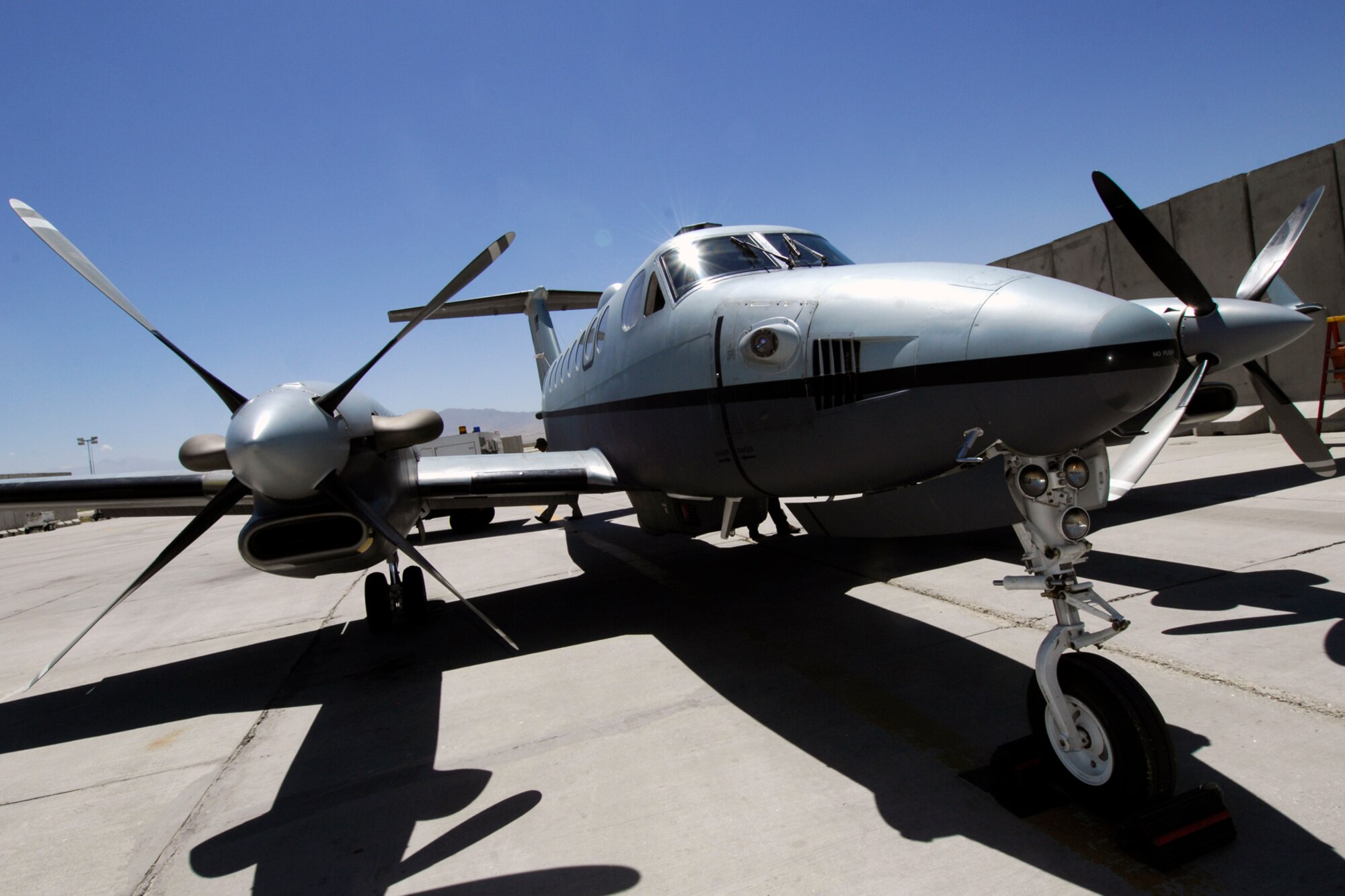 An MC-12 sits on the runway in preparation for a flight at Bagram Airfield, Afghanistan, June 29, 2012. The MC-12 mechanics inspect each aircraft after they land so that they’re prepared for the next flight. (U.S. Air Force photo/Staff Sgt. Jeff Nevison)