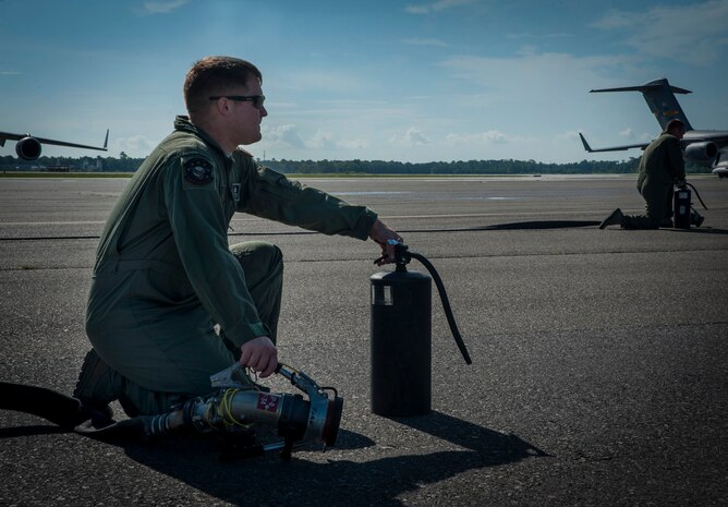 Staff Sgt. Mark Heitkamp, 628th Logistics Readiness Squadron Fuels Flight Forward Area Refueling Point team, demonstrates FARP operations at Joint Base Charleston - Air Base, July 12, 2012. The FARP’s mission is to hot refuel, refueling while the aircrafts’ engines are operating, from a transport aircraft (C-17 Globemaster III) to a receiver aircraft, under the cover of darkness in an austere environment. The team’s capability to refuel aircraft in remote locations helps support special operations teams worldwide. The C-17 Globemaster III not only has the capability to fly long distances and land in remote airfields in rough, land-locked regions, but it can also carry large equipment, supplies and troops directly to small airfields in harsh terrain anywhere in the world, day or night. (U.S. Air Force photo/Airman 1st Class Ashlee Galloway)