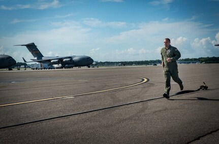 Master Sgt. Samuel Strong, 628th Logistics Readiness Squadron Fuels Flight Forward Area Refueling Point team, demonstrates FARP operations at Joint Base Charleston - Air Base, July 12, 2012. The FARP’s mission is to hot refuel, refueling while the aircrafts’ engines are operating, from a transport aircraft (C-17 Globemaster III) to a receiver aircraft, under the cover of darkness in an austere environment. The team’s capability to refuel aircraft in remote locations helps support special operations teams worldwide. The C-17 Globemaster III not only has the capability to fly long distances and land in remote airfields in rough, land-locked regions, but it can also carry large equipment, supplies and troops directly to small airfields in harsh terrain anywhere in the world, day or night. (U.S. Air Force photo/Airman 1st Class Ashlee Galloway)