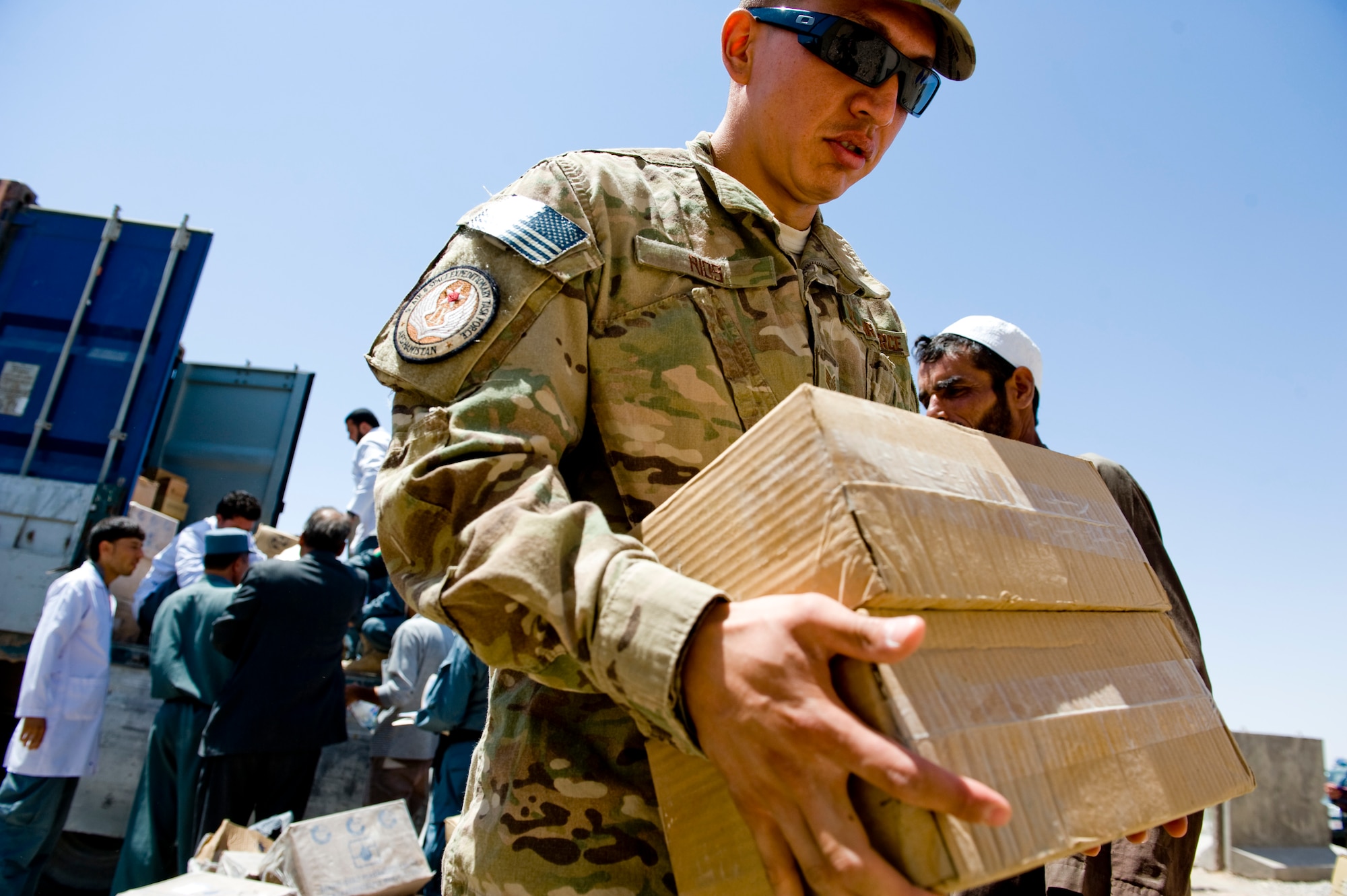 U.S. Air Force Staff Sgt. Anthony Rios, a preventive medicine mentor with the Joint Medical Operations Cell, carries newly arrived medical supplies to be inventoried for the Afghan National Police, Herat, Afghanistan, July 15, 2012. The medication and supplies were delivered from the Afghan Ministry of Interior's main warehouse in Kabul. (U.S. Air Force photo by Staff Sgt. Greg C. Biondo)(Released)