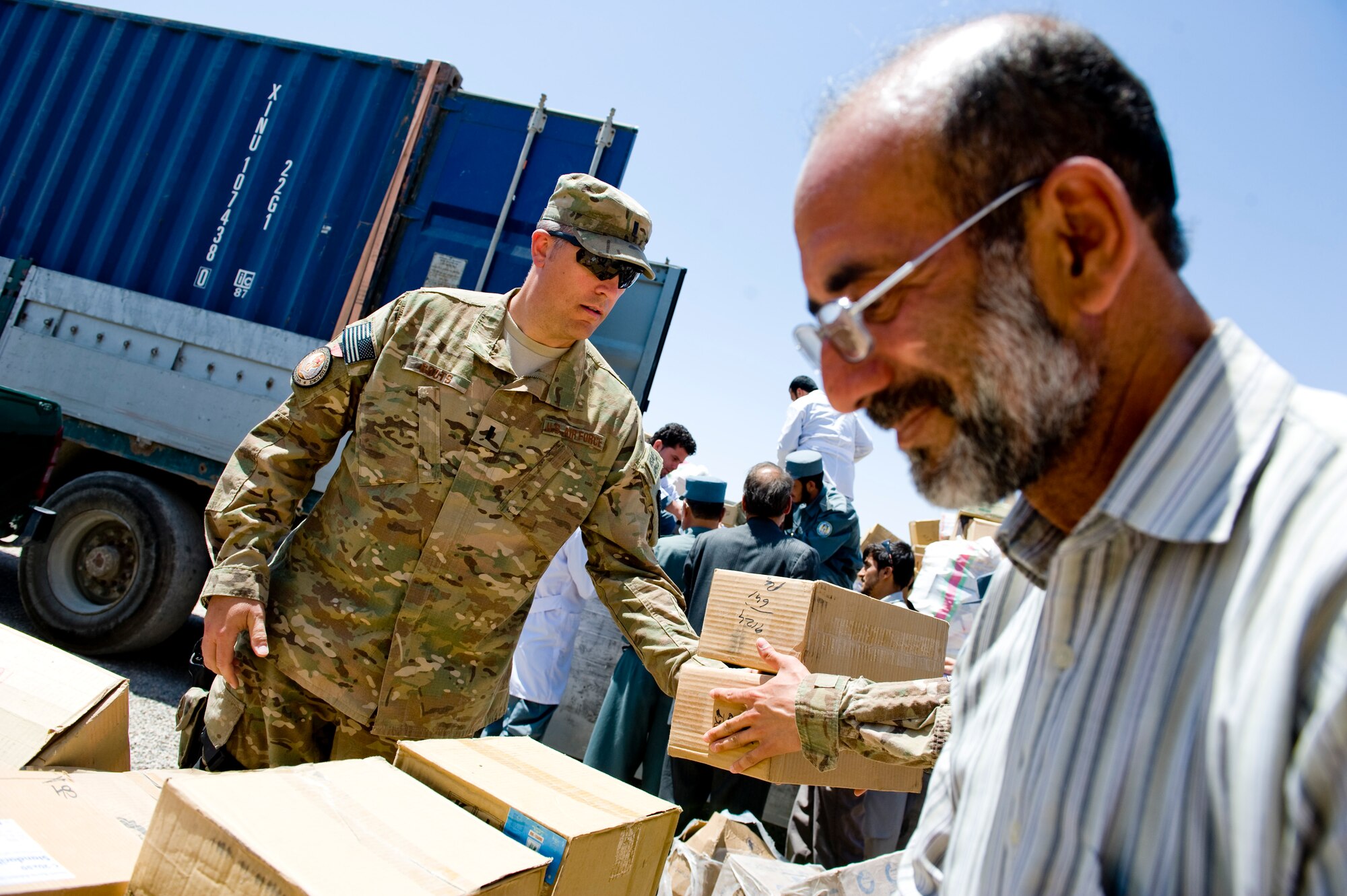 U.S. Air Force 1st Lt. Neil Boots, a preventive medicine mentor with the Joint Medical Operations Cell, carries newly arrived medical supplies to be inventoried for the Afghan National Police, Herat, Afghanistan, July 15, 2012. The medication and supplies were delivered from the Afghan Ministry of Interior's main warehouse in Kabul. (U.S. Air Force photo by Staff Sgt. Greg C. Biondo)(Released)