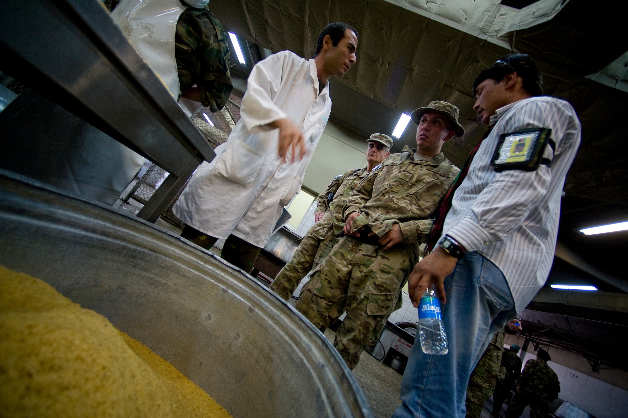 U.S. Air Force Maj. Jose Diaz and Staff Sgt. Anthony Rios, preventive medicine mentors with the Joint Medical Operations Center, inspect an Afghan military dining facility, Camp Stone, Afghanistan, July 14, 2012. The JMOC assists Afghans in developing a sustainable medical support system. (U.S. Air Force photo by Staff Sgt. Greg C. Biondo)(Released)