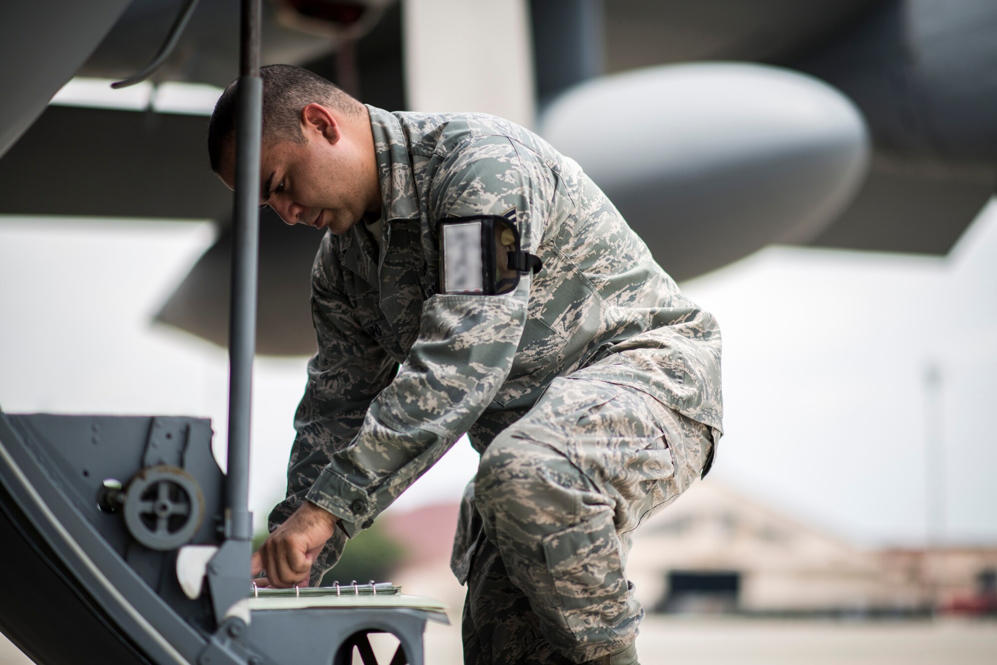 YOKOTA AIR BASE, Japan -- Staff Sgt. Galen Apo, 374th Maintenance Group quality assurance inspector, performs an aircraft forms inspection on a C-130 Hercules at Yokota Air Base, Japan, July 25, 2012. Apo and his fellow QA members received the first 100 percent pass rate of any MXG QA section in Pacific Air Forces in more than a year during their Logistics Compliance Assessment Program Inspection earlier that year. (U.S. Air Force photo/Tech. Sgt. Samuel Morse)