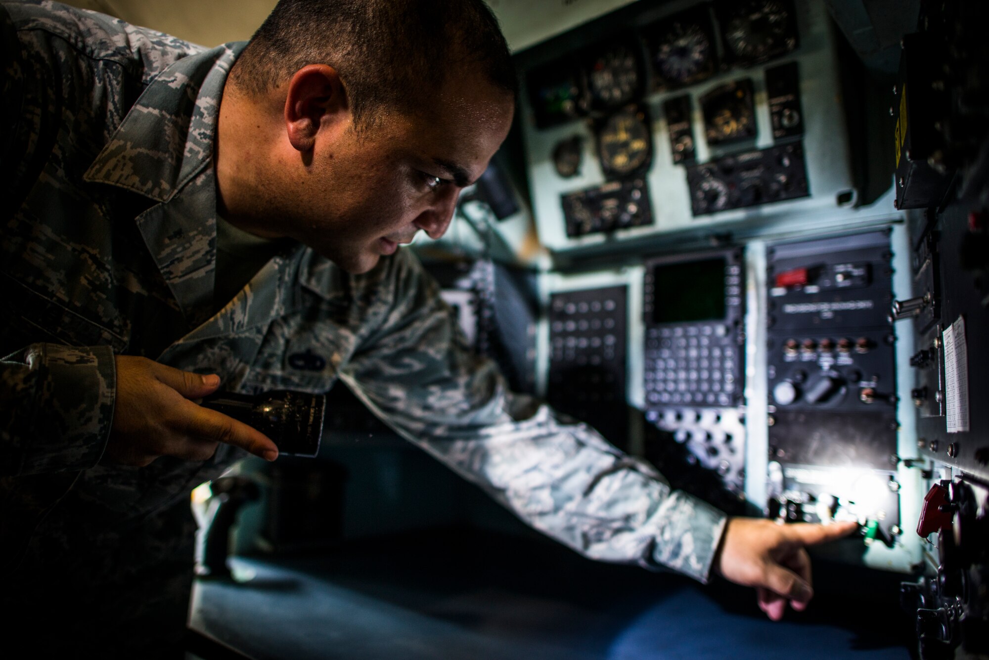 YOKOTA AIR BASE, Japan -- Staff Sgt. Galen Apo, 374th Maintenance Group quality assurance inspector, performs a quality verification inspection on liquid oxygen servicing in a C-130 Hercules at Yokota Air Base, Japan, July 25, 2012. The QA section performs more than 225 inspections per month to make sure the aircraft at Yokota are being properly maintained. (U.S. Air Force photo/Tech. Sgt. Samuel Morse)