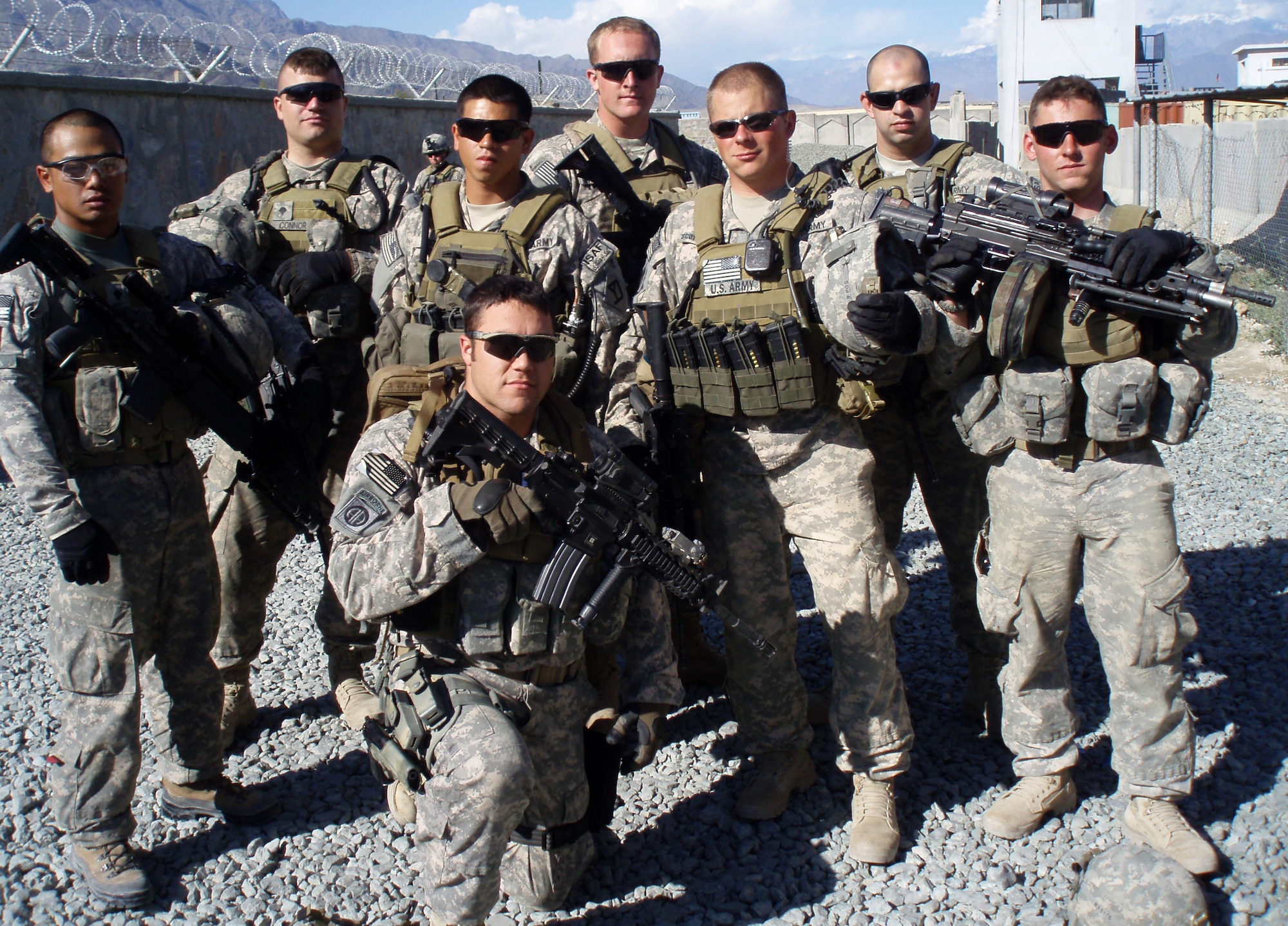 U.S. Air Force Staff Sgt. Warren Williamson Jr., a medic with the 18th Medical Operations Squadron, and soldiers from the 1st Battalion, 181st Infantry Regiment, Bravo Company, pose for a photo during their deployment in Afghanistan last year. Williamson received NCO Association Vanguard Award during the NCO Association Vanguard Tribute Banquet at the NCOA 2012 Annual Convention in Las Vegas, Nev., July 12, 2012, for his heroic actions during his deployed. (Courtesy photo)