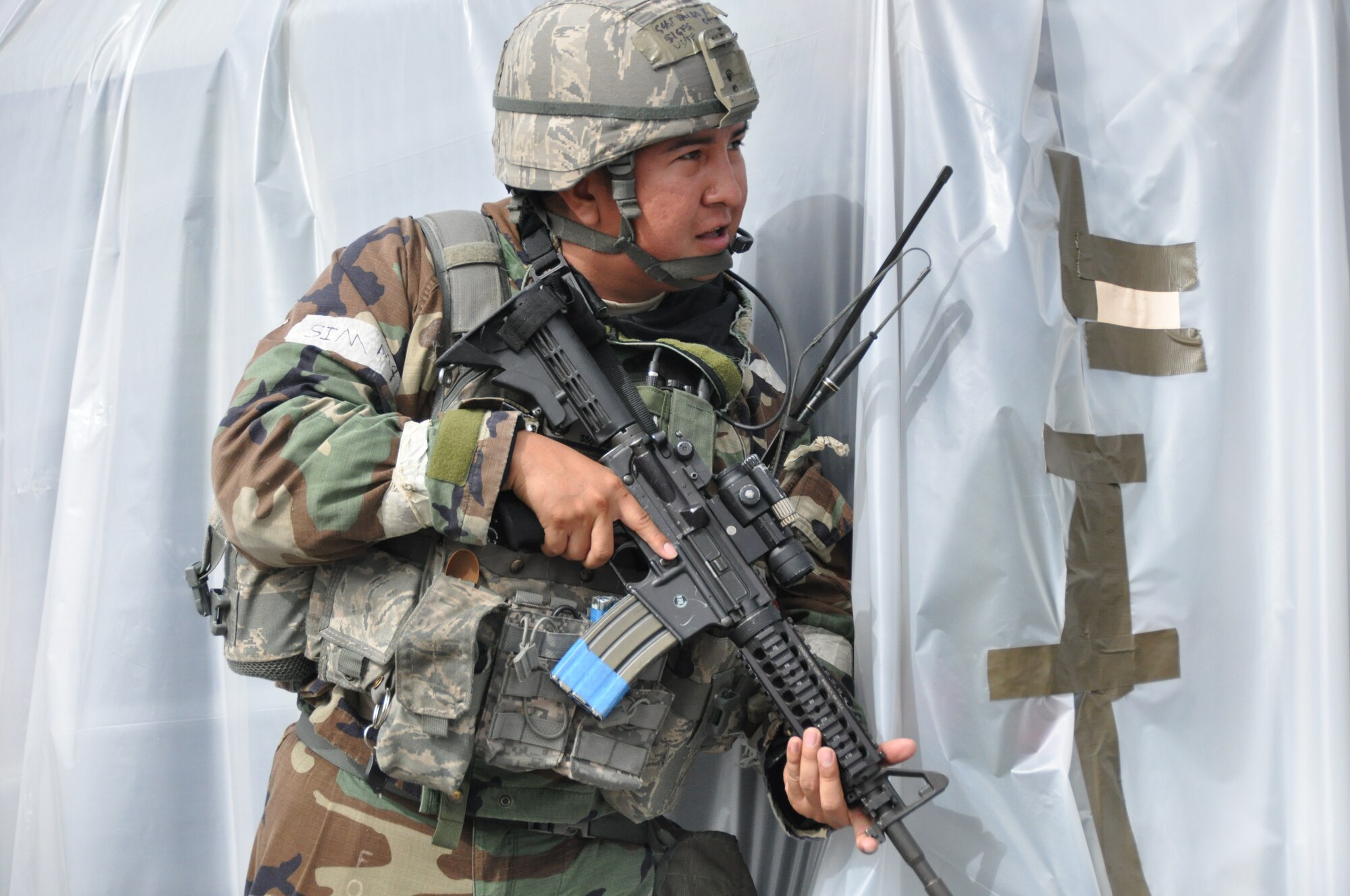 Staff Sgt. Kendrick Valdo, 51st Security Forces Squadron member, holds a defensive position against opposing forces during operational readiness exercise Beverly Midnight 12-03 at Osan Air Base, Republic of Korea, July 25, 2012. Throughout the week, Osan Mustangs demonstrate the ability to operate in a chemical environment as well as administer self-aid and buddy-care during a wartime environment. BM 12-03 is the fourth ORE for Team Osan in 2012. (U.S. Air Force photo/Senior Airman Michael Battles)