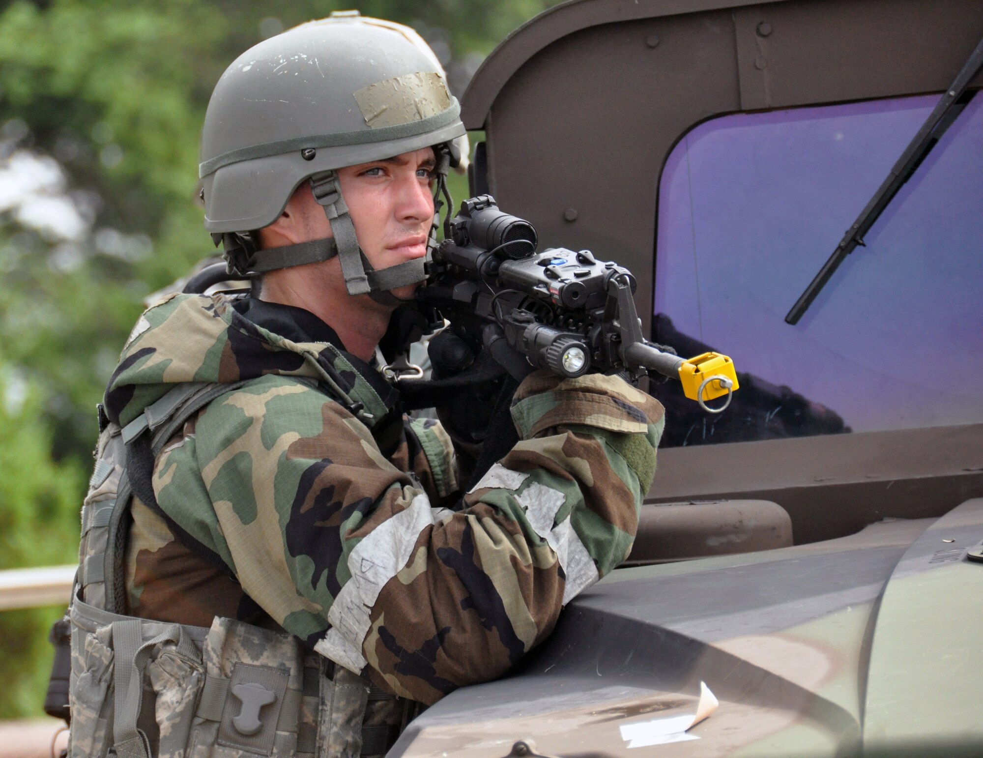 A 51st Security Forces Squadron augmentee holds a defensive position against opposing forces during operational readiness exercise Beverly Midnight 12-03 at Osan Air Base, Republic of Korea, July 25, 2012. Airmen are provided by each base unit to augment the security needs of the base during real-world and exercise events. BM 12-03 is the fourth ORE for Team Osan in 2012. (U.S. Air Force photo/Senior Airman Michael Battles)