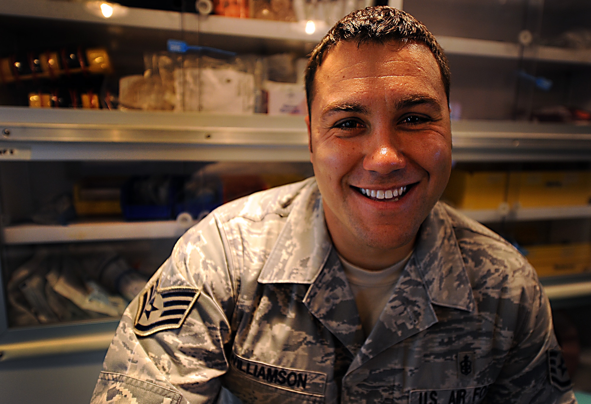 U.S. Air Force Staff Sgt. Warren Williamson Jr., a medic with the 18th Medical Operations Squadron, sits in his "office", an ambulance, at Kadena Air Base, Japan, July 24, 2012. Williamson was recently awarded the NCO Association Vanguard Award, for his heroic actions that saved the lives of others during a deployment to Afghanistan last year. (U.S. Air Force photo/Staff Sgt. Sara Csurilla)