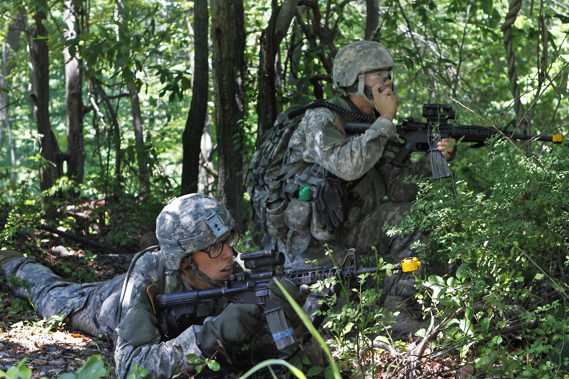 An Army Cadet Uses A Radio To Report A Situation To His