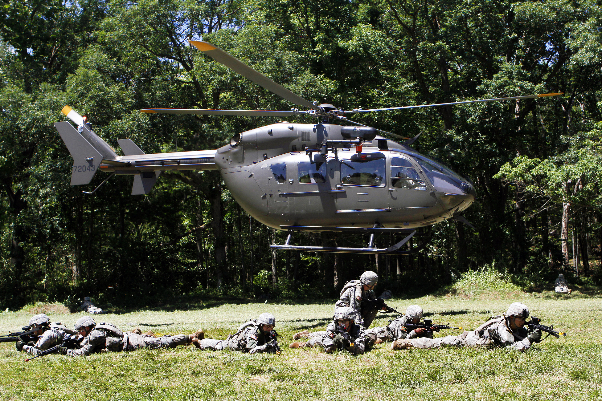 Army Cadets Establish A Security Perimeter While A Uh 72 Lakota Helicopter Lands To Retrieve Them