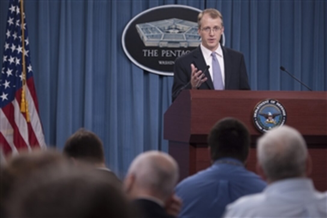 Acting Assistant Secretary of Defense for Public Affairs George Little briefs the media on the planned sequence of actions to remove the flight restrictions on the Air Force's F-22 Raptor during a Pentagon press briefing on July 24, 2012.  