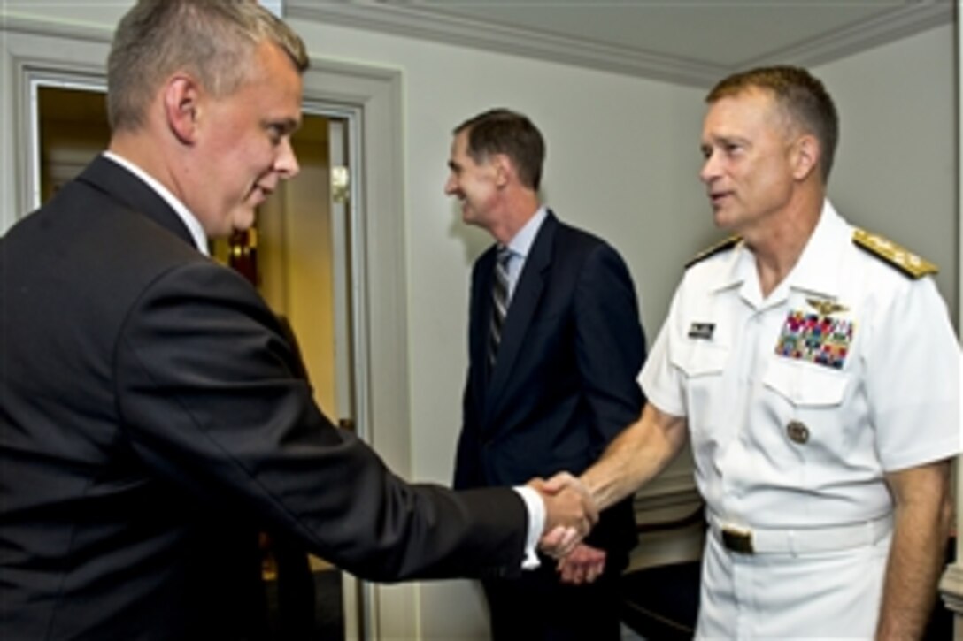 Polish Defense Minister Tomasz Siemoniak shakes hands with U.S. Navy Adm. James A. Winnefeld Jr., vice chairman of the Joint Chiefs of Staff, before a meeting at the Pentagon, July 25, 2012. U.S. Defense Secretary Leon E. Panetta hosted a meeting of defense leaders to discuss issues of mutual concern.