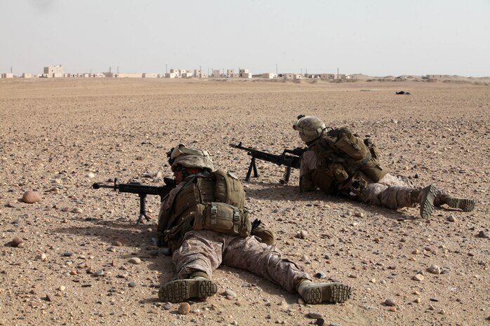 Marines with 1st Platoon, Alpha Company, Battalion Landing Team 1st Battalion, 2nd Marine Regiment, 24th Marine Expeditionary Unit, maintain their sectors of fire during a security halt as they patrol toward a simulated objective as part of a vertical assault training operation at Landing Zone Gerber in Kuwait, July 9, 2012. The 24th MEU is deployed with the Iwo Jima Amphibious Ready Group as a U.S. Central Command theater reserve force providing support for maritime security operations and theater security cooperation efforts in the U.S. 5th Fleet area of responsibility.
