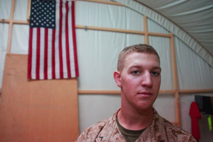 Pfc. Jeffrey Tobash, an Allentown, Pa., native and intelligence specialist with Battalion Landing Team 1st Battalion, 2nd Marine Regiment, 24th Marine Expeditionary Unit, poses for a photograph in his current living quarters aboard Camp Buehring, Kuwait, July 25, 2012. Tobash, just three weeks passed his 19th birthday, is the youngest Marine in the 24th MEU, deployed with the Iwo Jima Amphibious Ready Group as a U.S. Central Command theater reserve force providing support for maritime security operations and theater security cooperation efforts in the U.S. 5th Fleet area of responsibility.