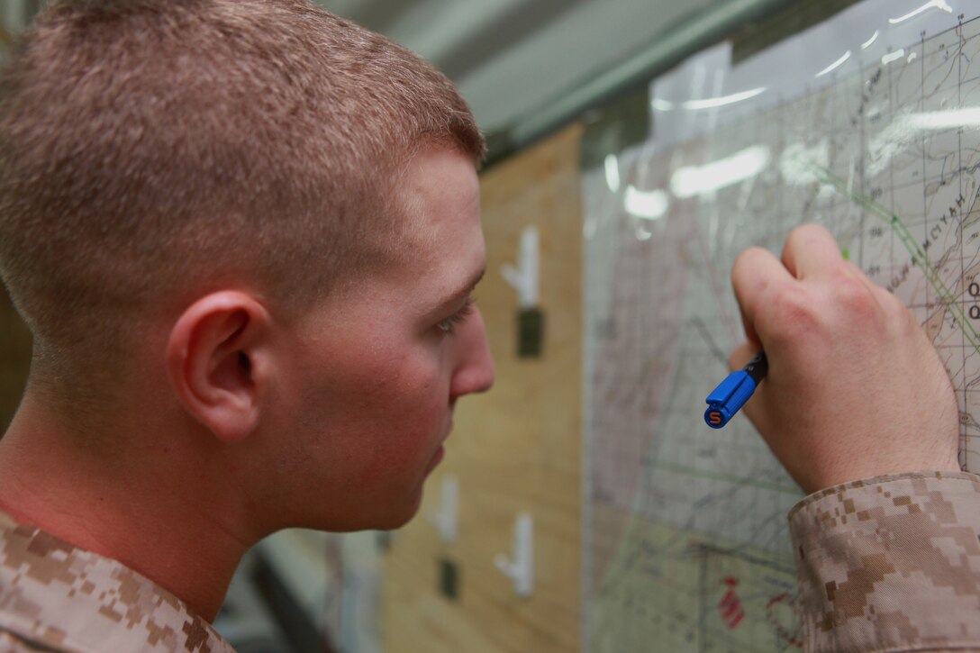 Pfc. Jeffrey Tobash, an Allentown, Pa., native and intelligence specialist with Battalion Landing Team 1st Battalion, 2nd Marine Regiment, 24th Marine Expeditionary Unit, plots a location on a map in the BLT command operations center aboard Camp Buehring, Kuwait, July 25, 2012. Tobash, just three weeks passed his 19th birthday, is the youngest Marine in the 24th MEU, deployed with the Iwo Jima Amphibious Ready Group as a U.S. Central Command theater reserve force providing support for maritime security operations and theater security cooperation efforts in the U.S. 5th Fleet area of responsibility.